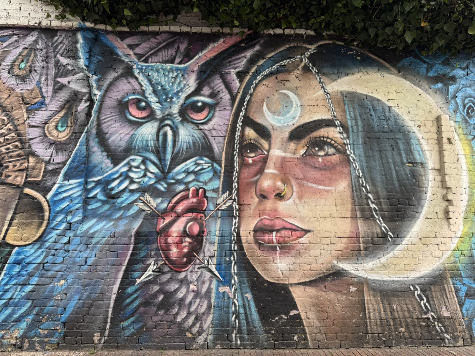 Owl and woman mural in La Candelaria