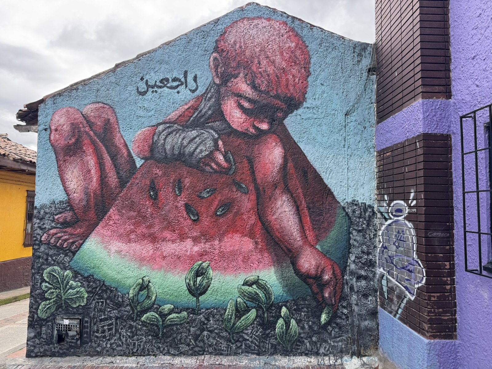 Mural of a child with a watermelon in La Candelaria