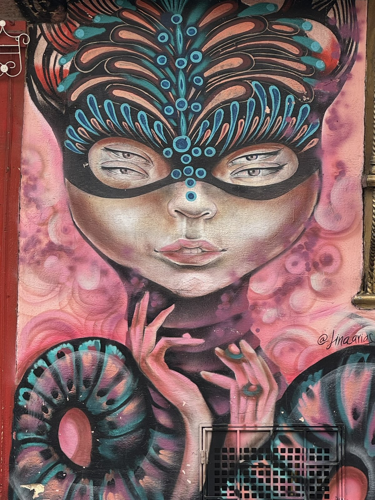 Colorful masked face in Bogotá street art