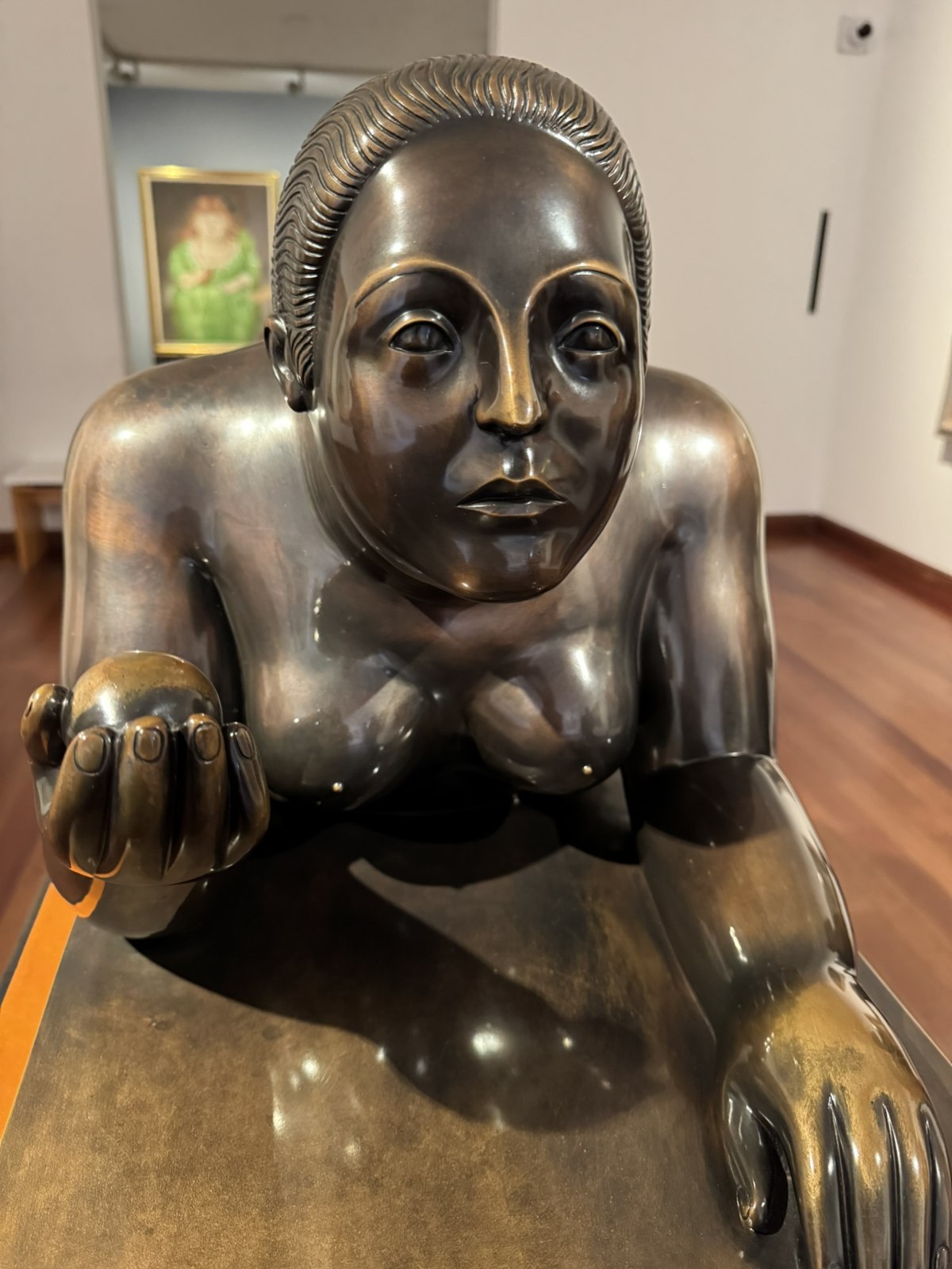 Rounded bronze figure on display at Museo Botero