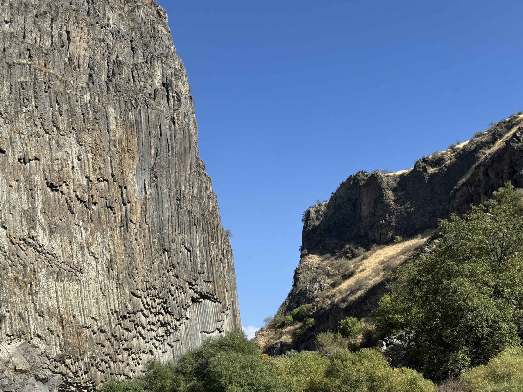 Basalt cliffs rising above the path through Garni Gorge.