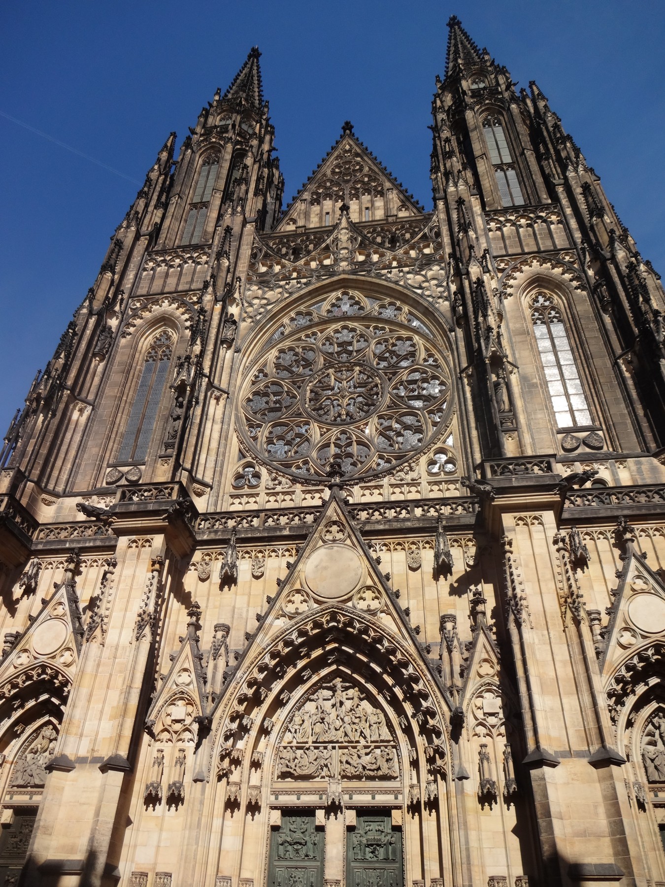 The Gothic entrance and rose window of St. Vitus Cathedral in Prague.