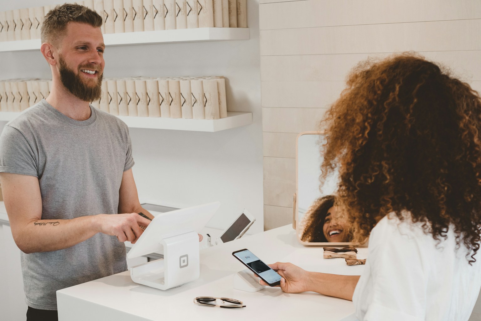 Customer making a card payment at a small business counter