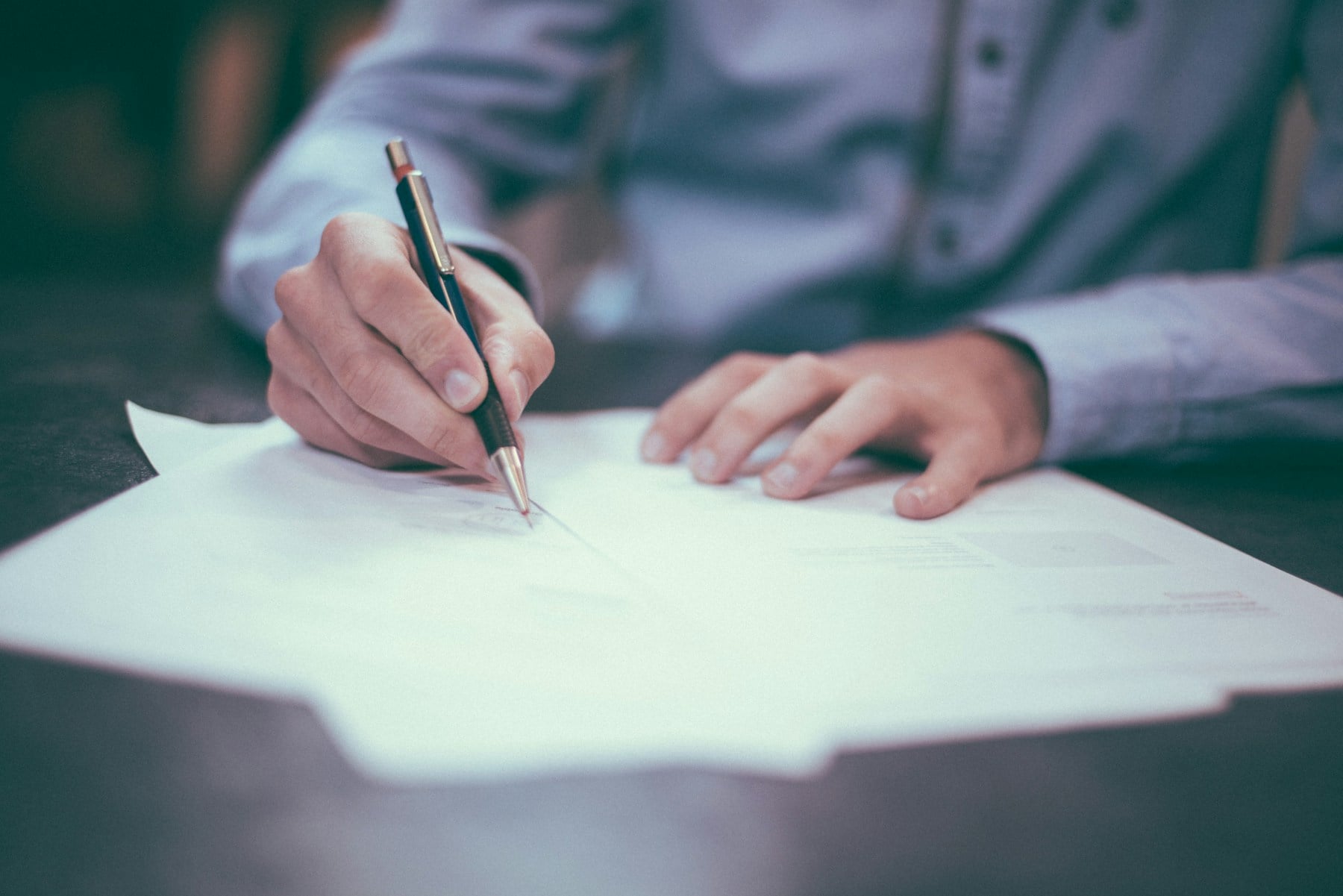 Business owner reviewing a document at a desk