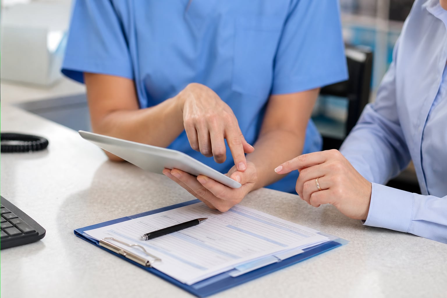 Practice staff reviewing coverage details and appointment information