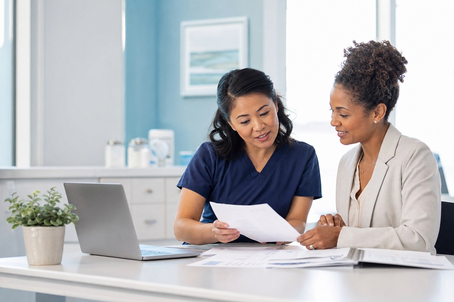 Healthcare practice team reviewing reports