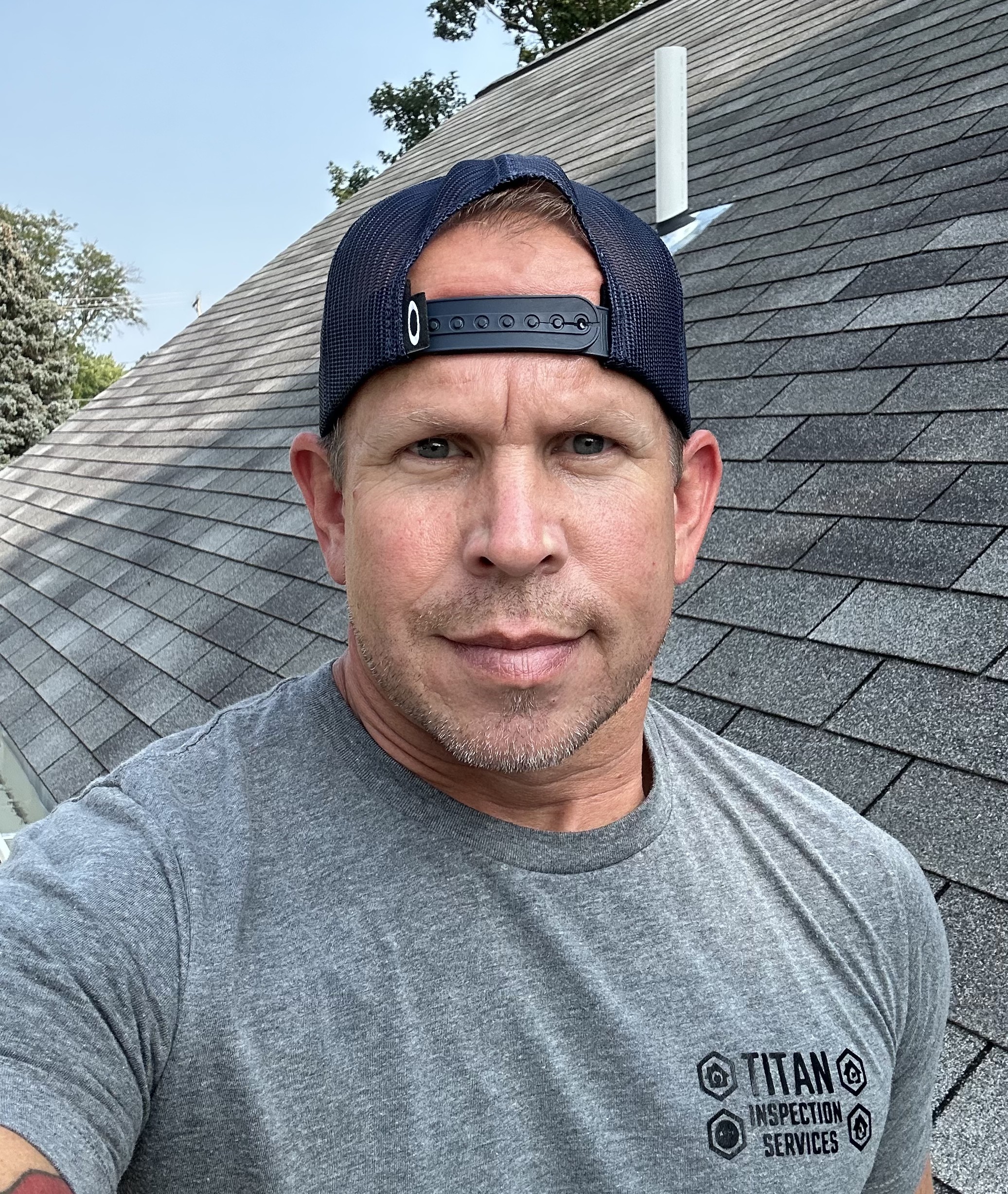 Jeff Ferguson on a residential roof during an inspection