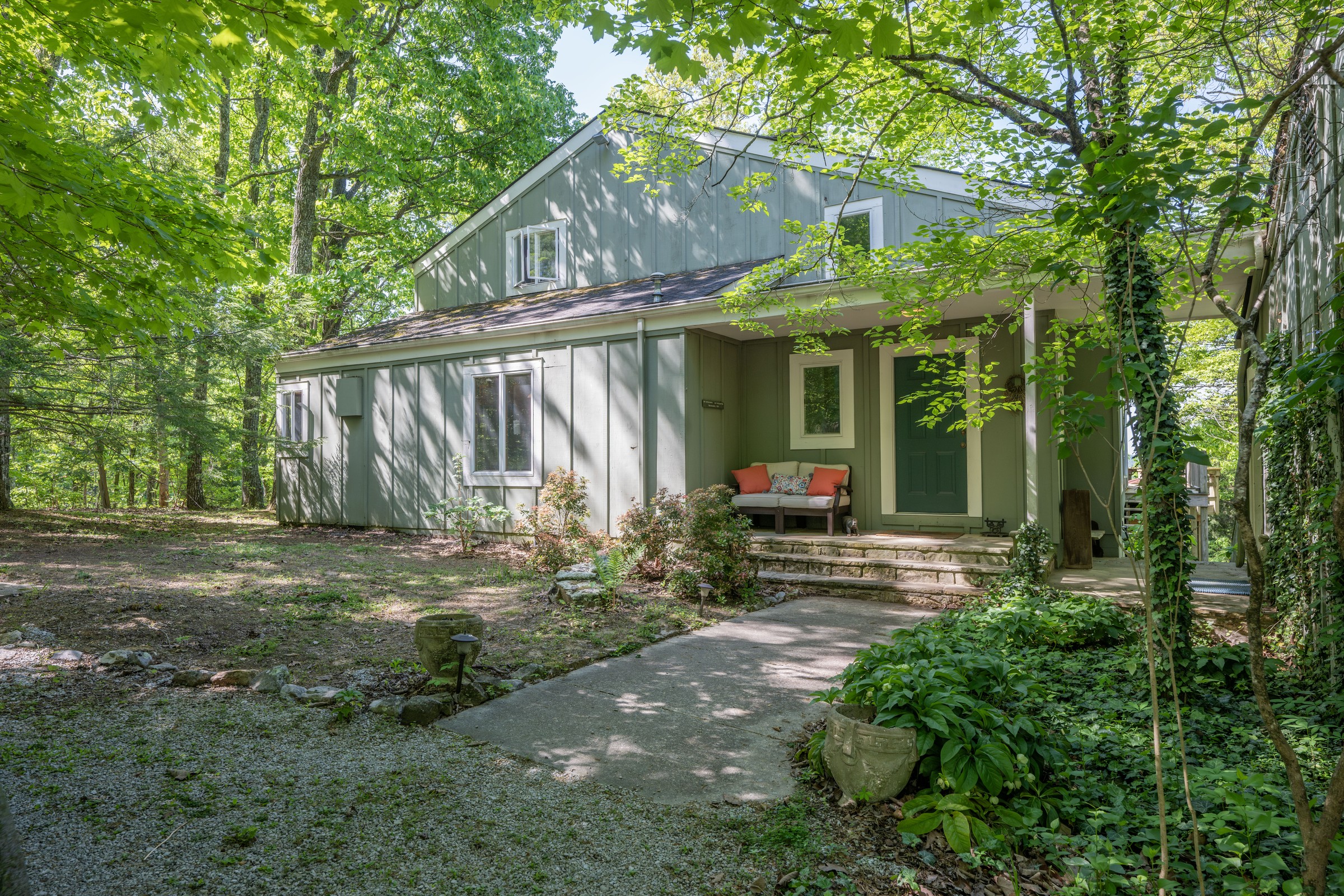 Exterior of 3442 Sherwood Road set among mature trees