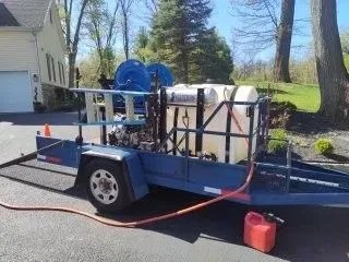 StateWide technician and hydro-jet equipment at a sewer cleanout