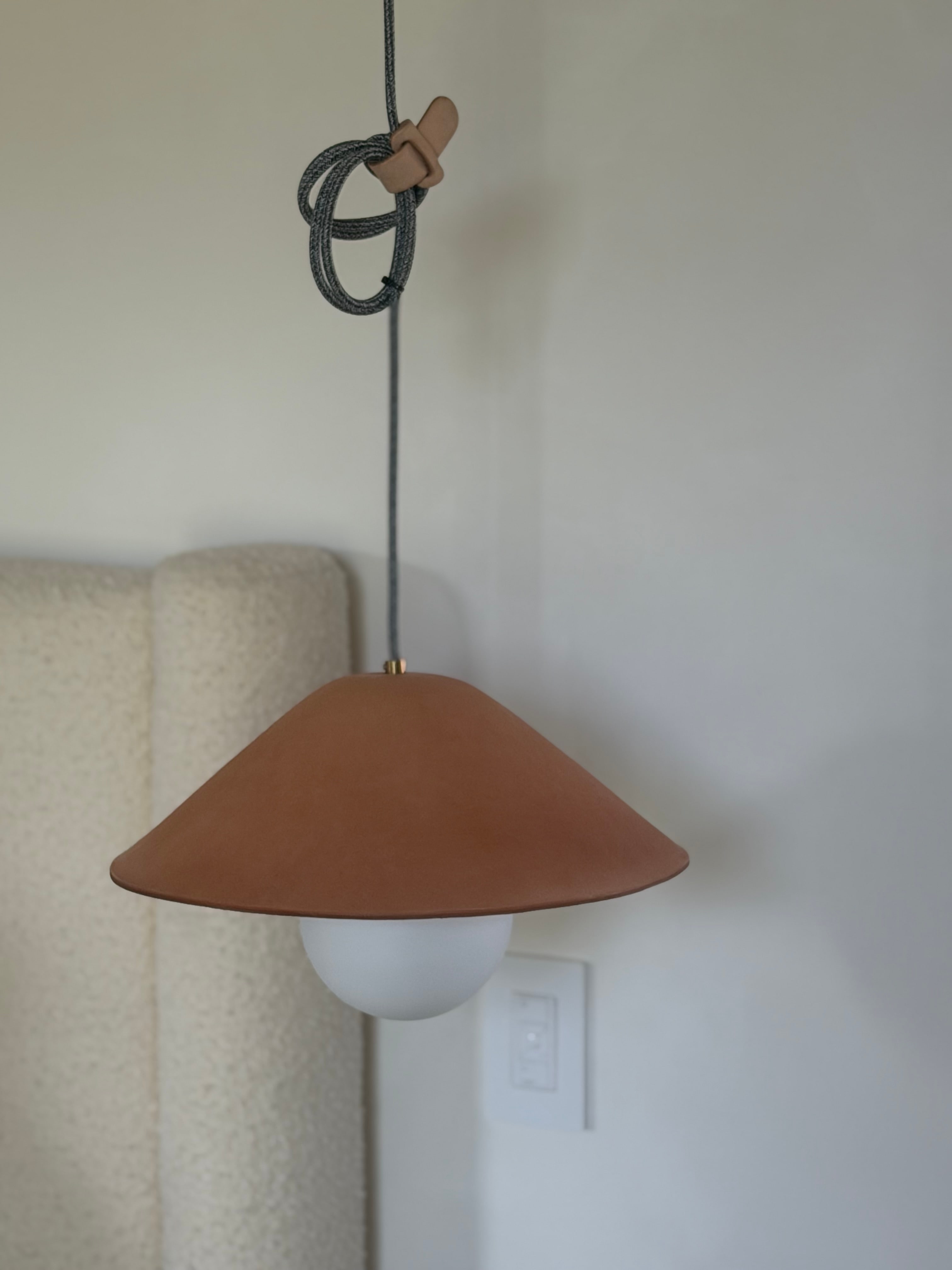 Terracotta leather bedside pendant light in Hollywood Hills Residence