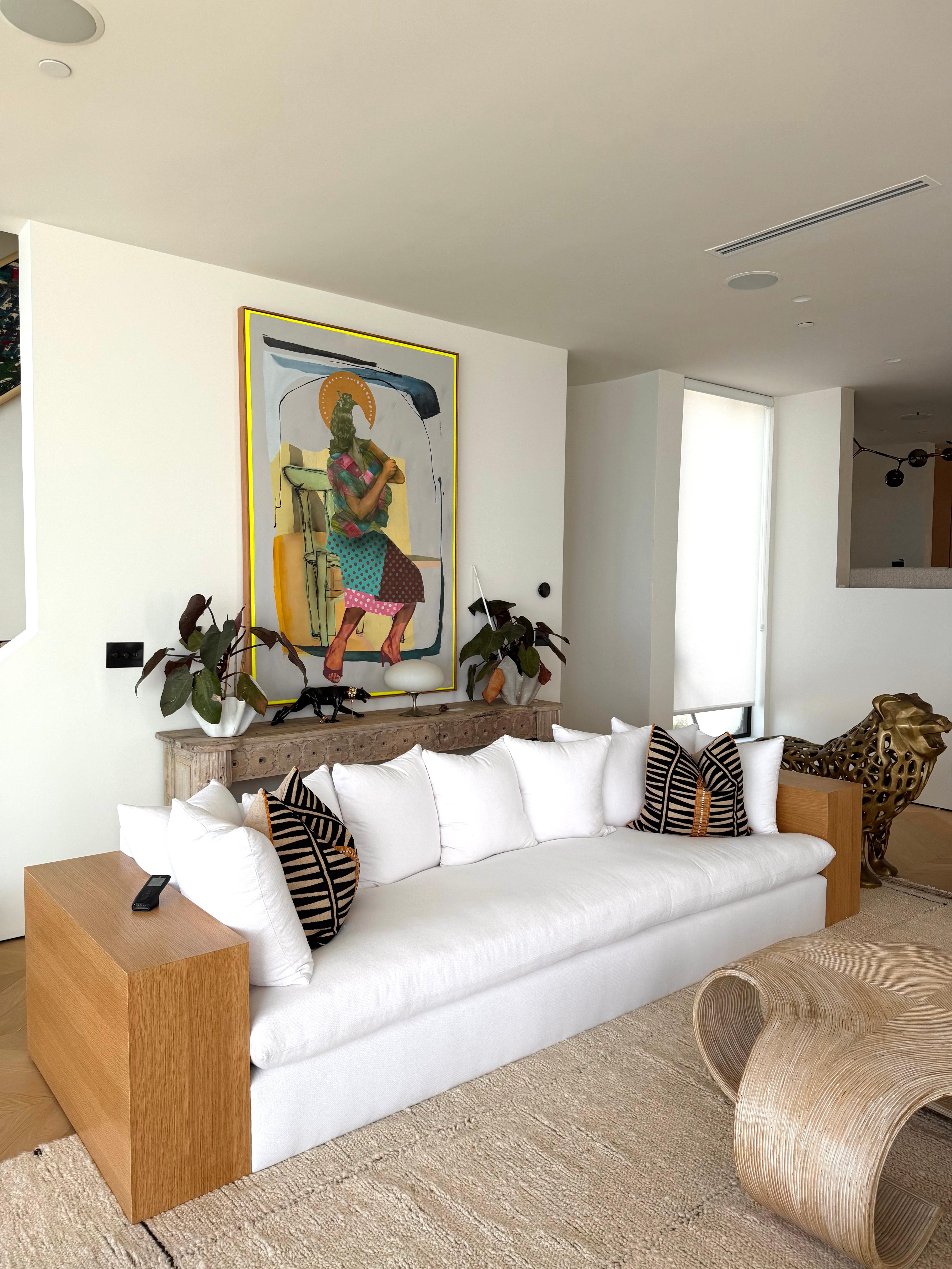 Custom 10-foot sofa and sculptural vintage coffee table in the Malibu Residence living room