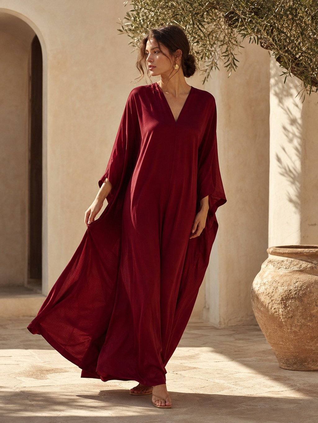 Woman wearing a flowing wine-red caftan