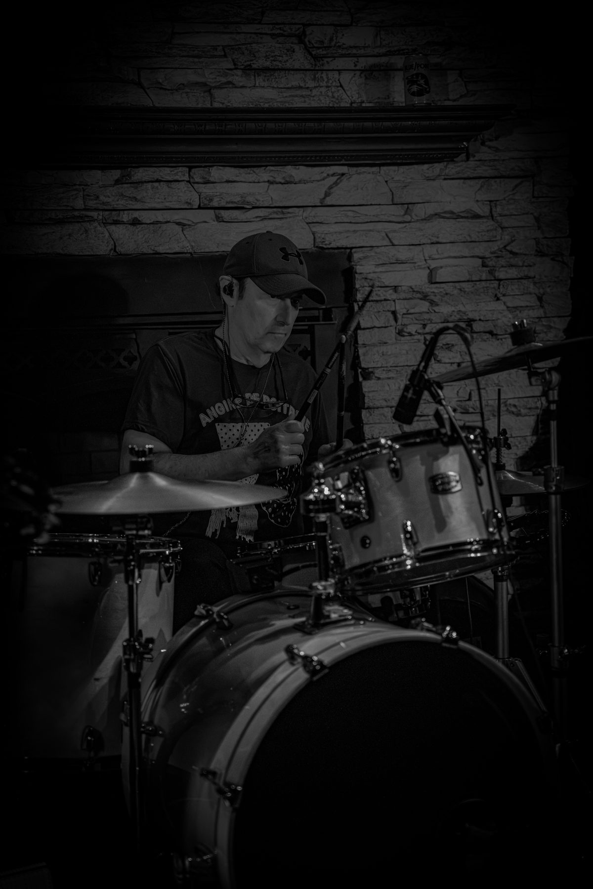 The Wonderwall drummer playing under club lights
