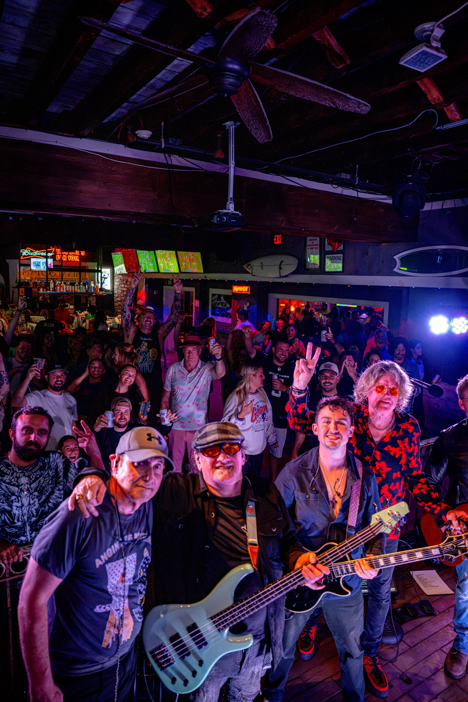 The Wonderwall performing in front of a cheering crowd