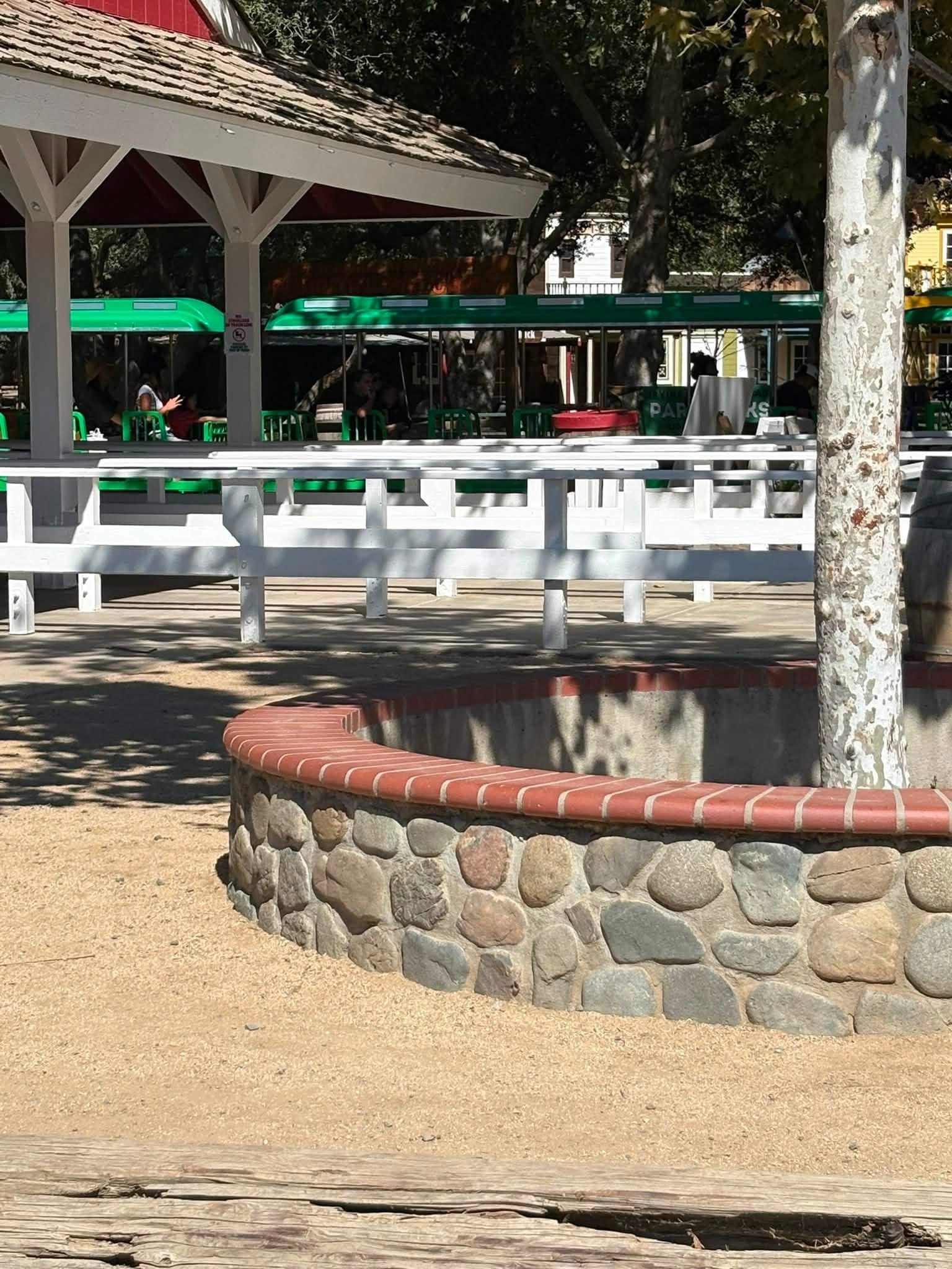 Families riding the green train at Irvine Regional Park