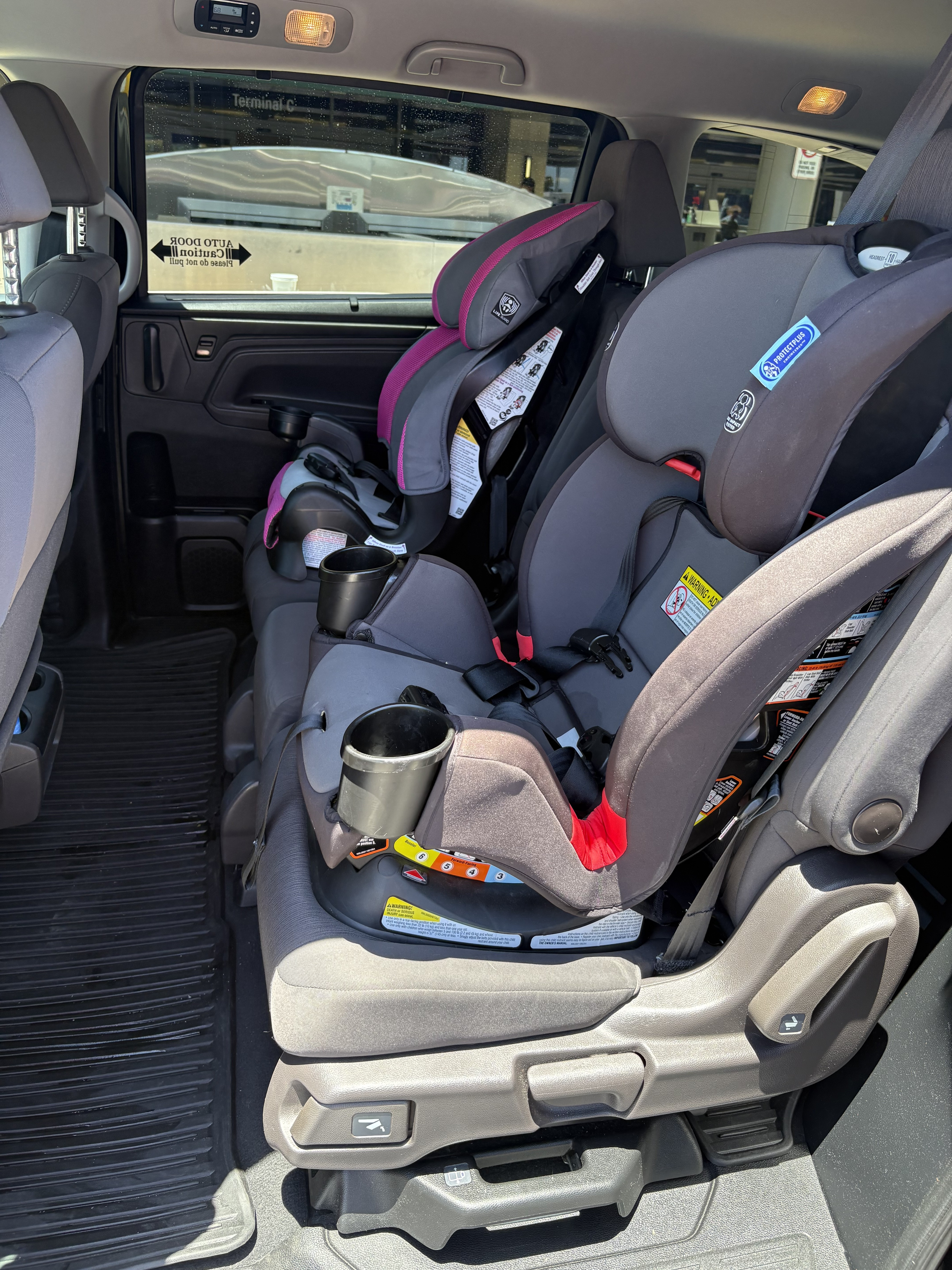 Child safety seats installed in a City Cruze LA Honda Odyssey
