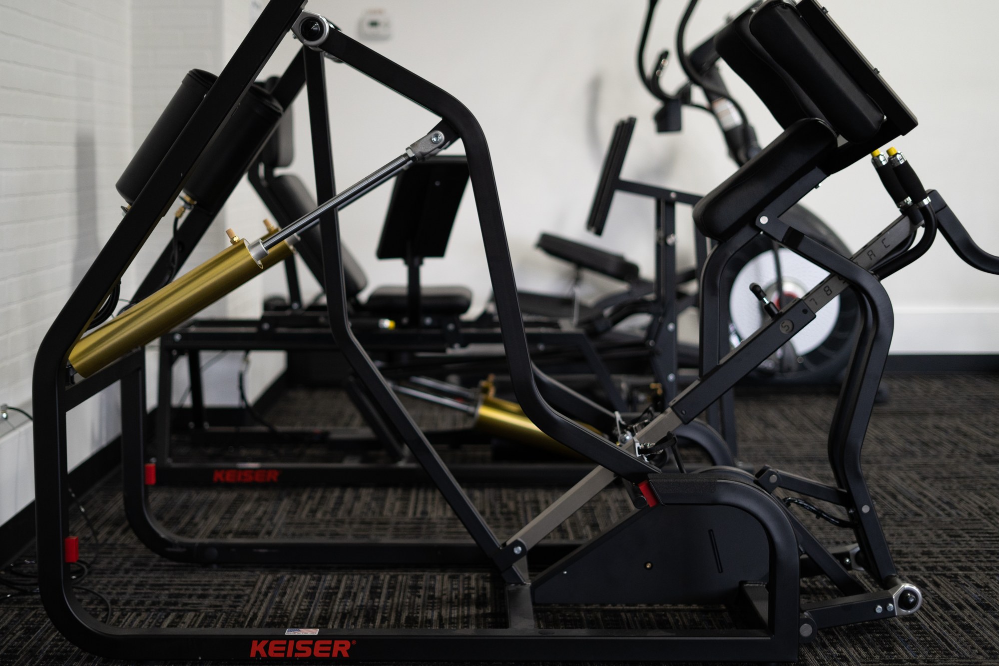Fit-Rx member using Keiser pneumatic resistance equipment