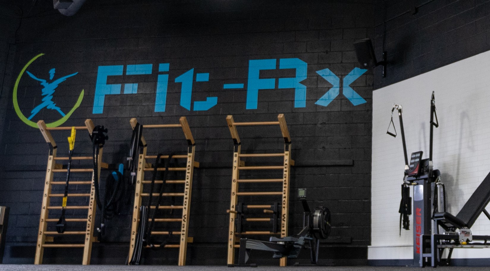 Fit-Rx member using Keiser pneumatic resistance equipment
