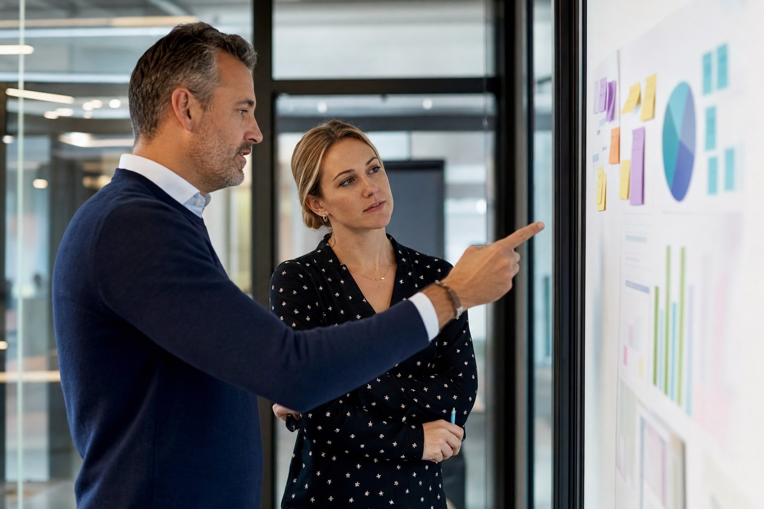 Sales manager and account executive reviewing pipeline priorities together