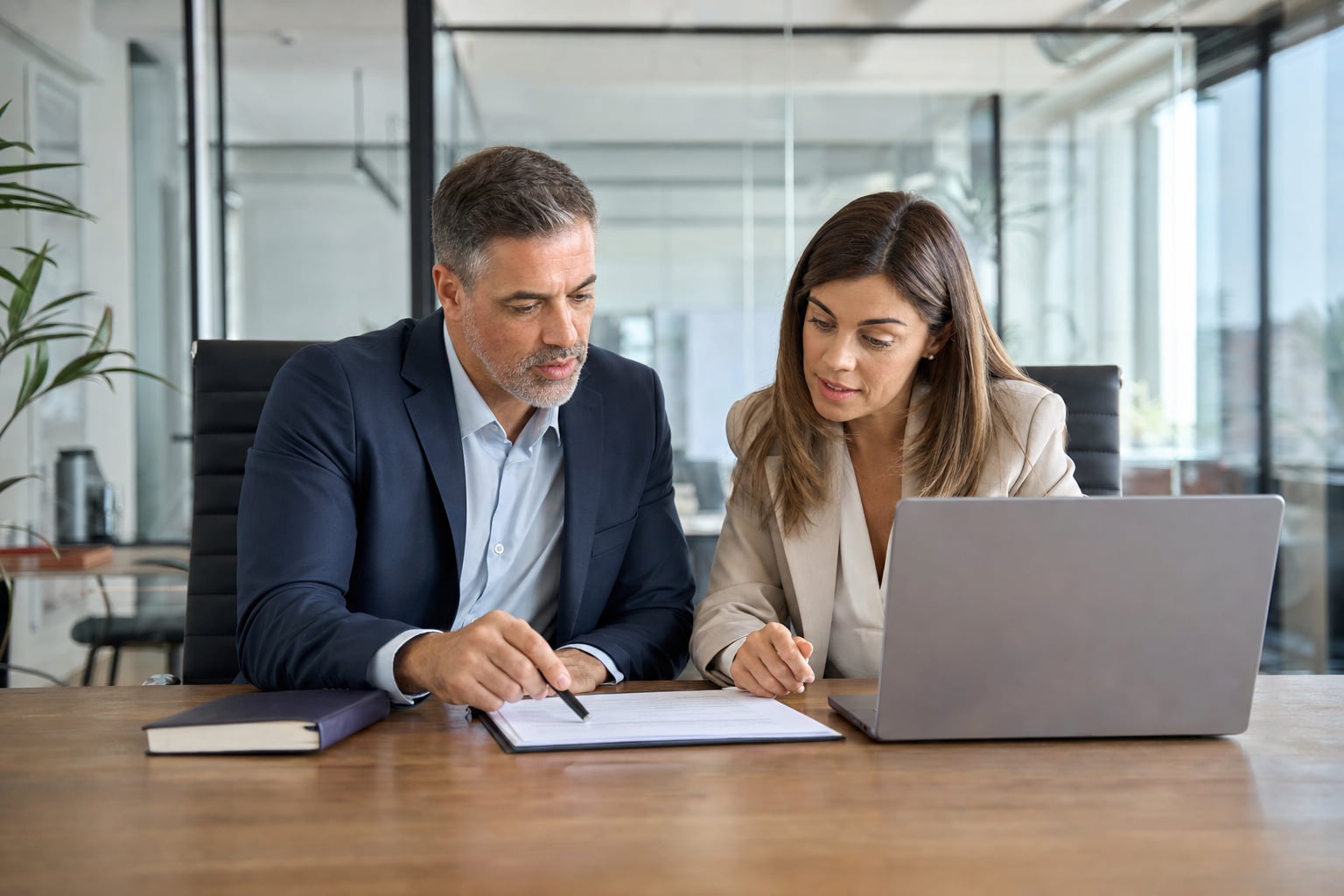 Sales manager coaching a representative through an account plan