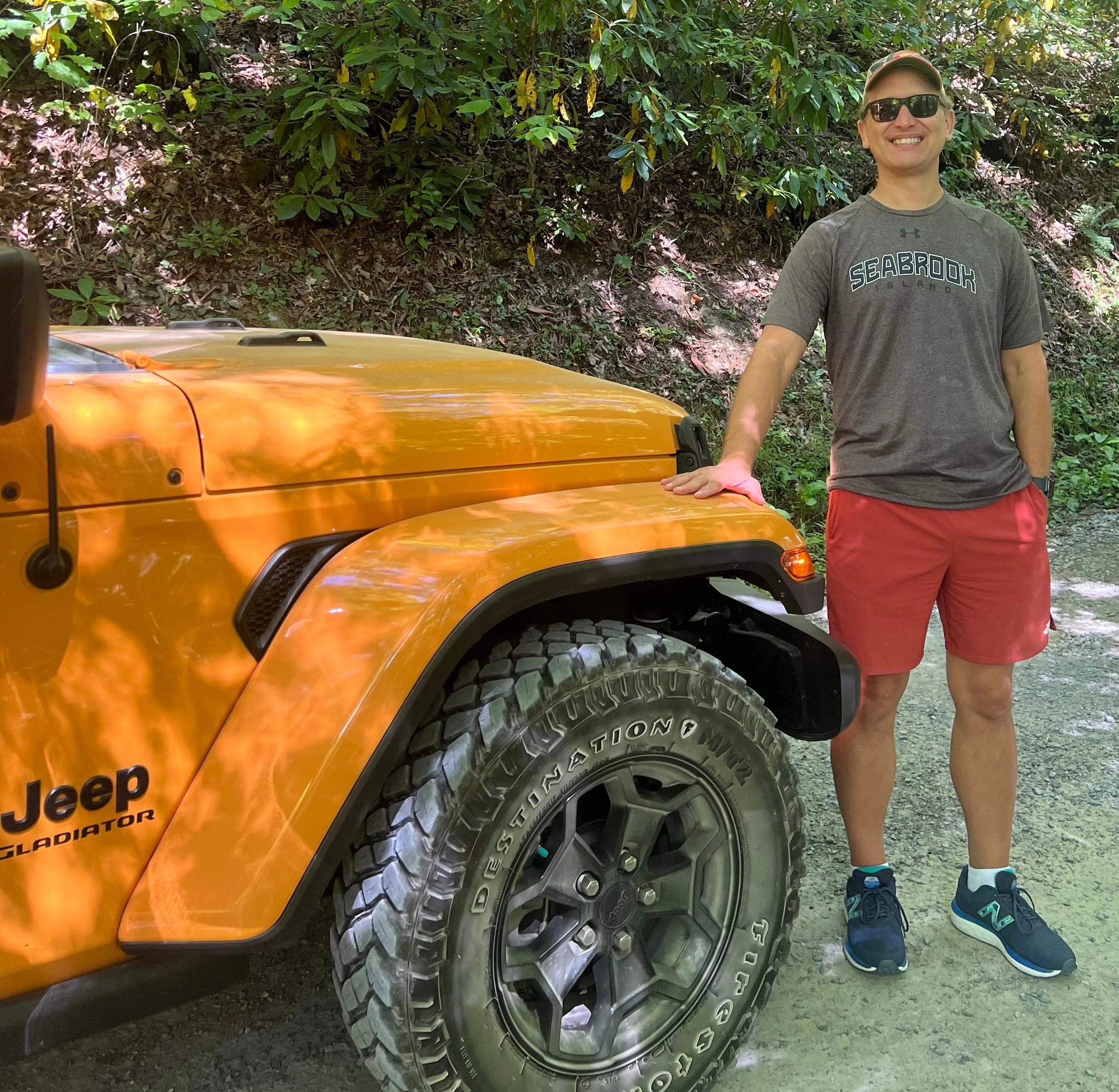 Nelson Leiser outdoors beside his Jeep