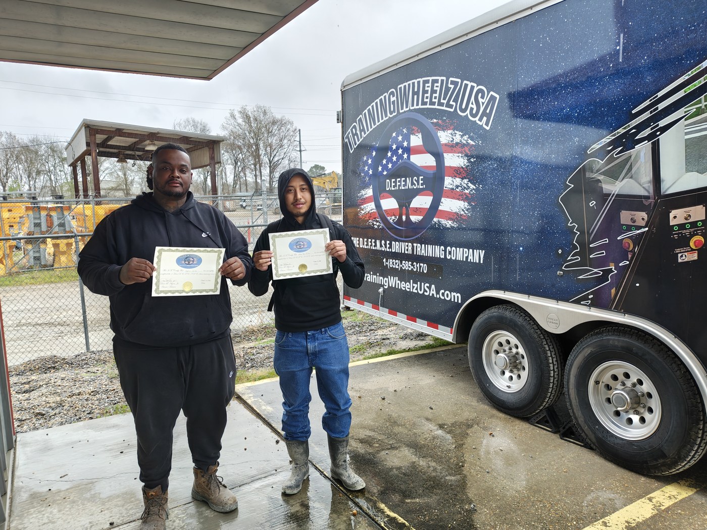 Training Wheelz USA team beside the mobile trailer