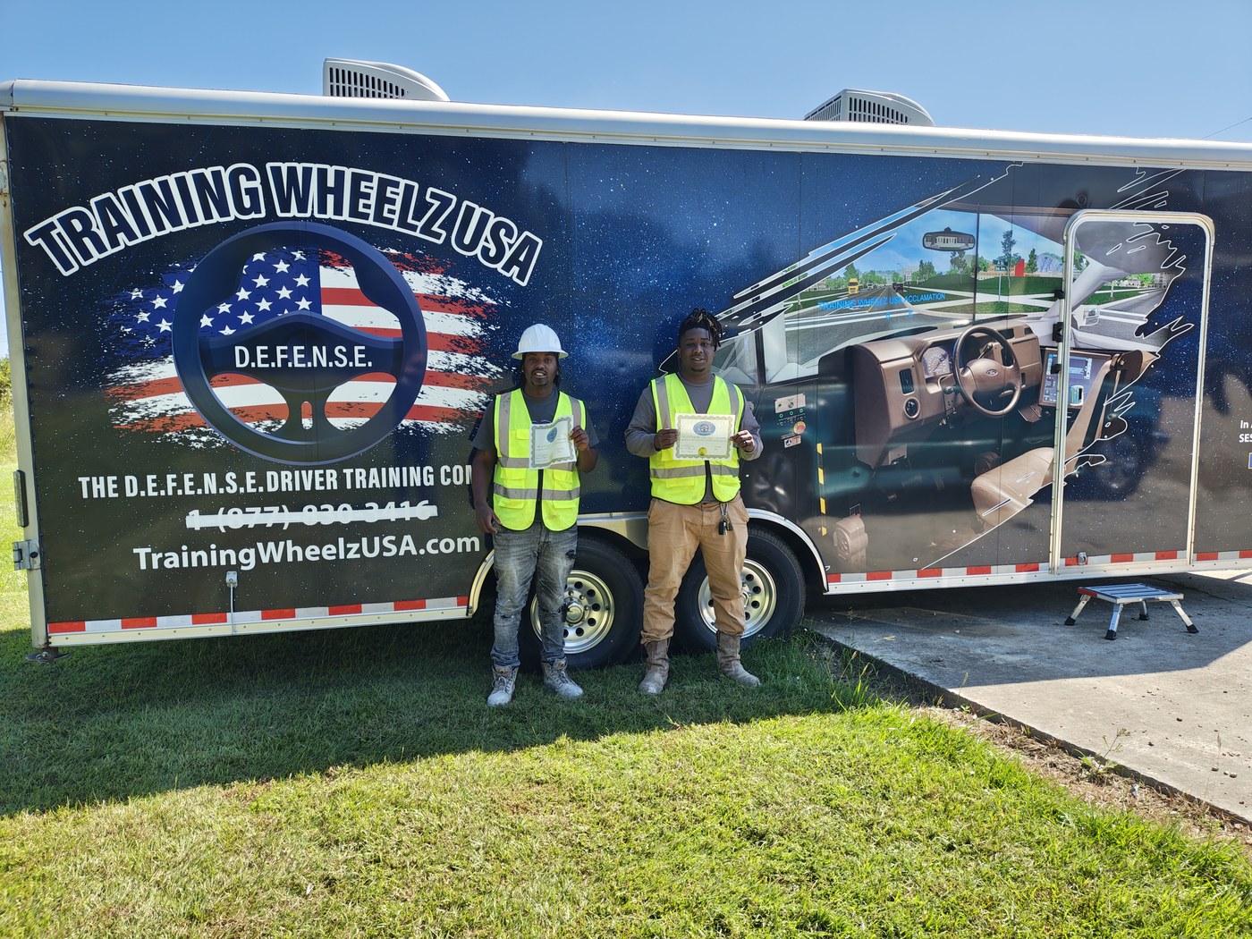 Training Wheelz USA team at the mobile training trailer