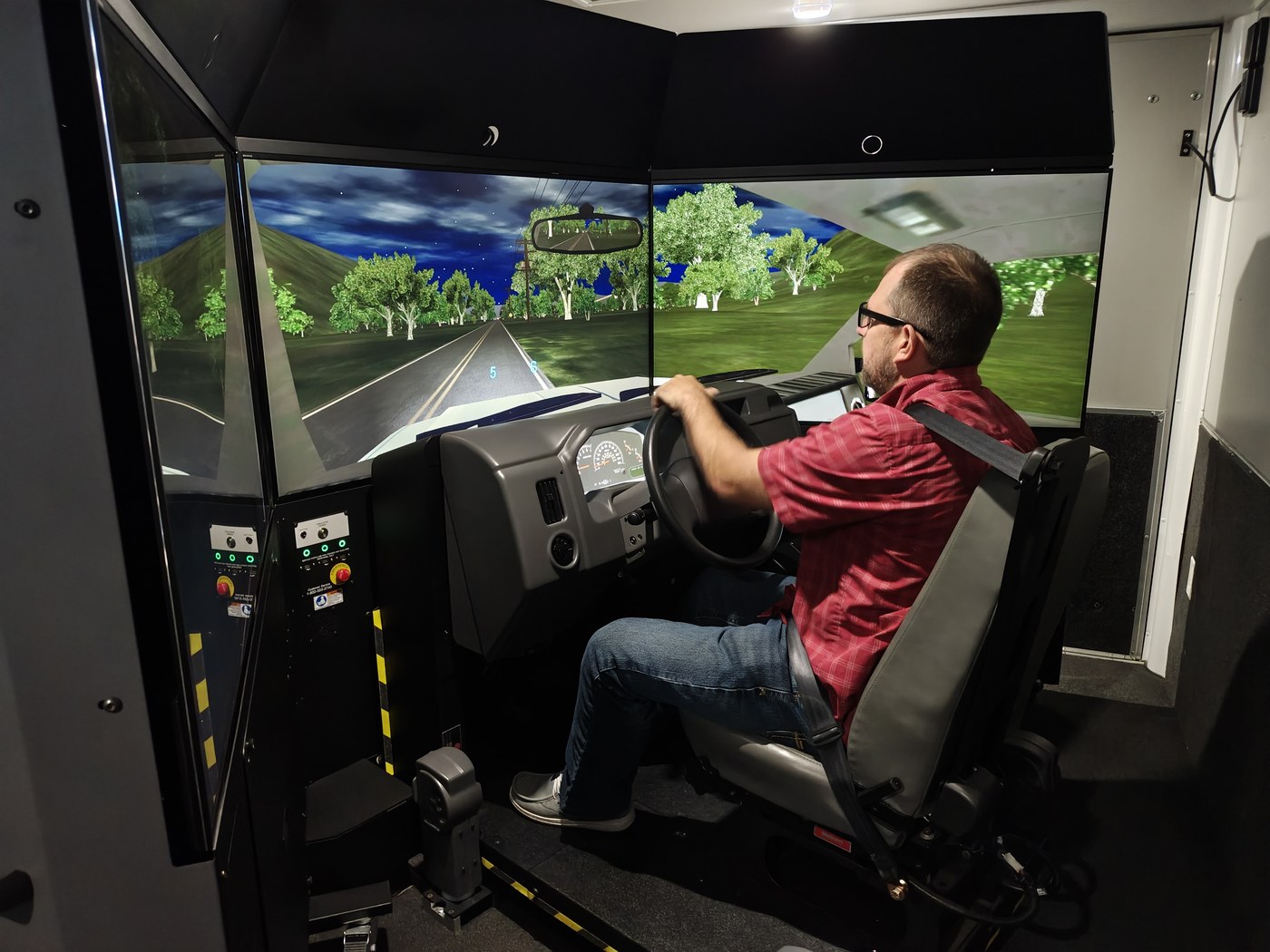 Driver using the simulator screens
