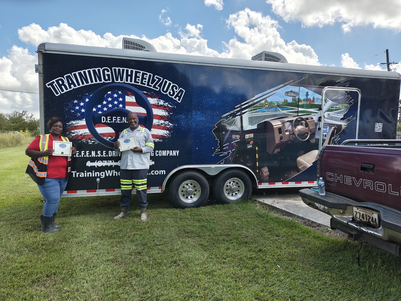 Training Wheelz USA team by the mobile trailer