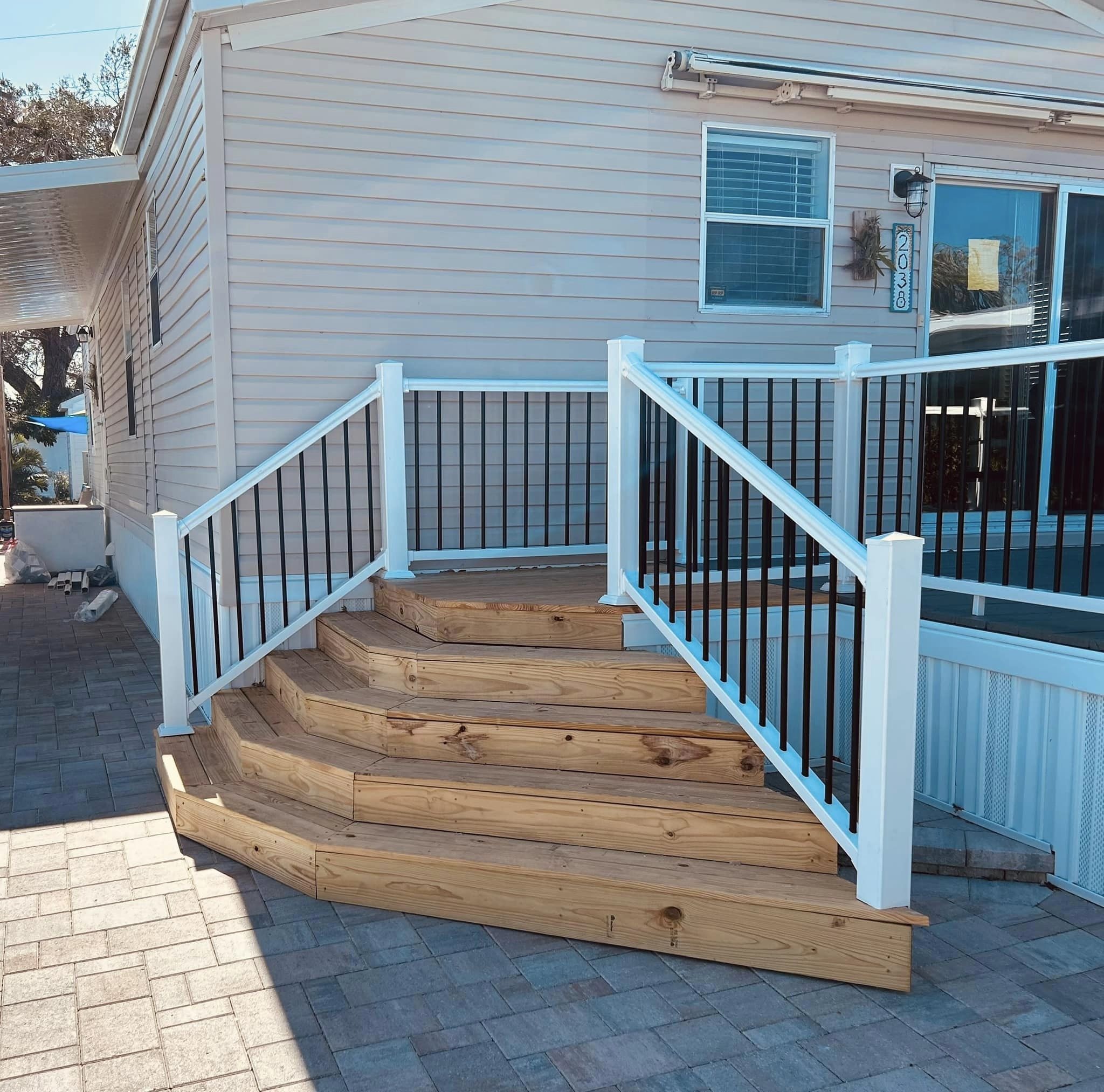 Raised wood deck built beside a Southwest Florida home