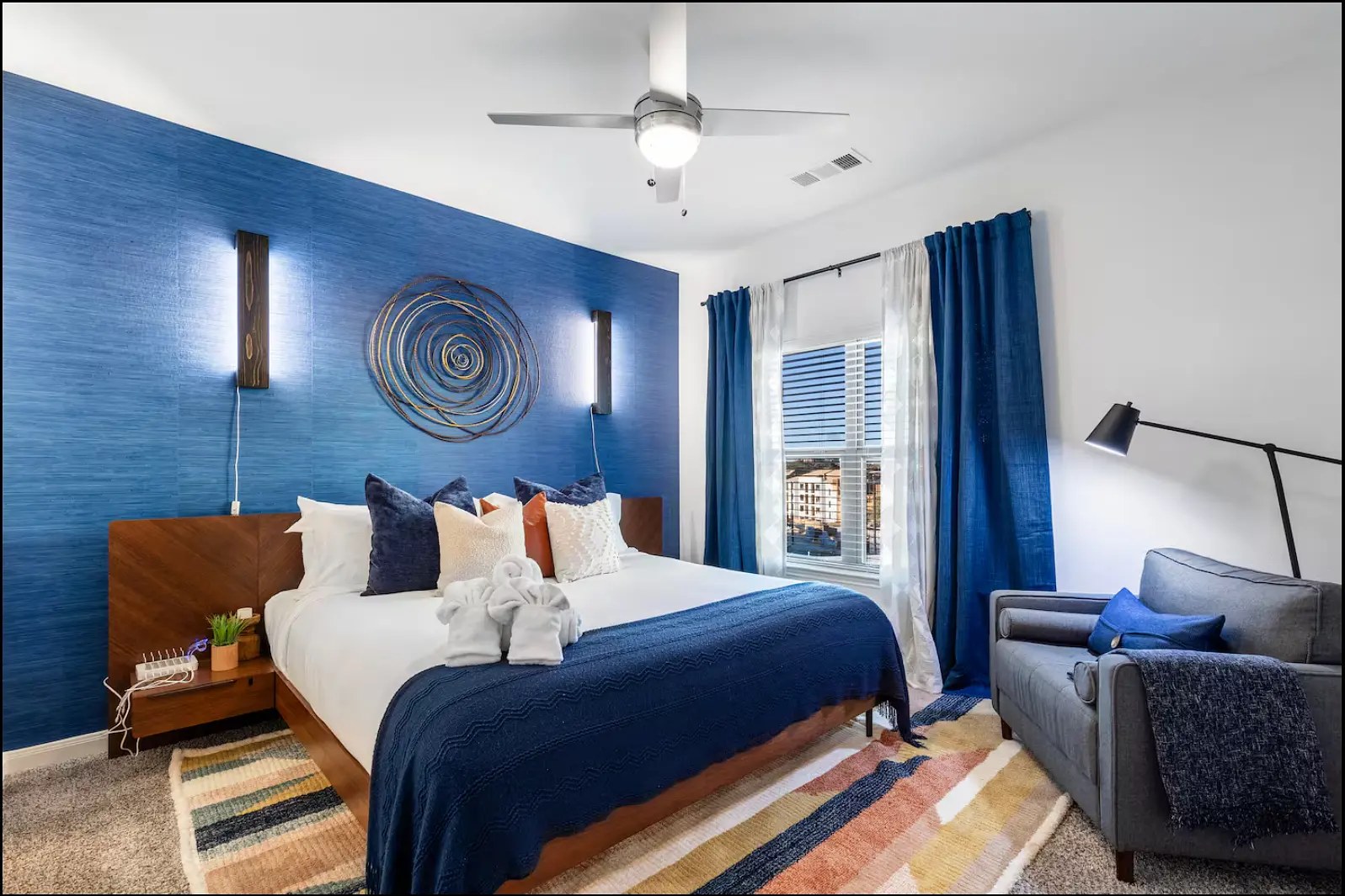 Finished bedroom with deep blue wall and custom details