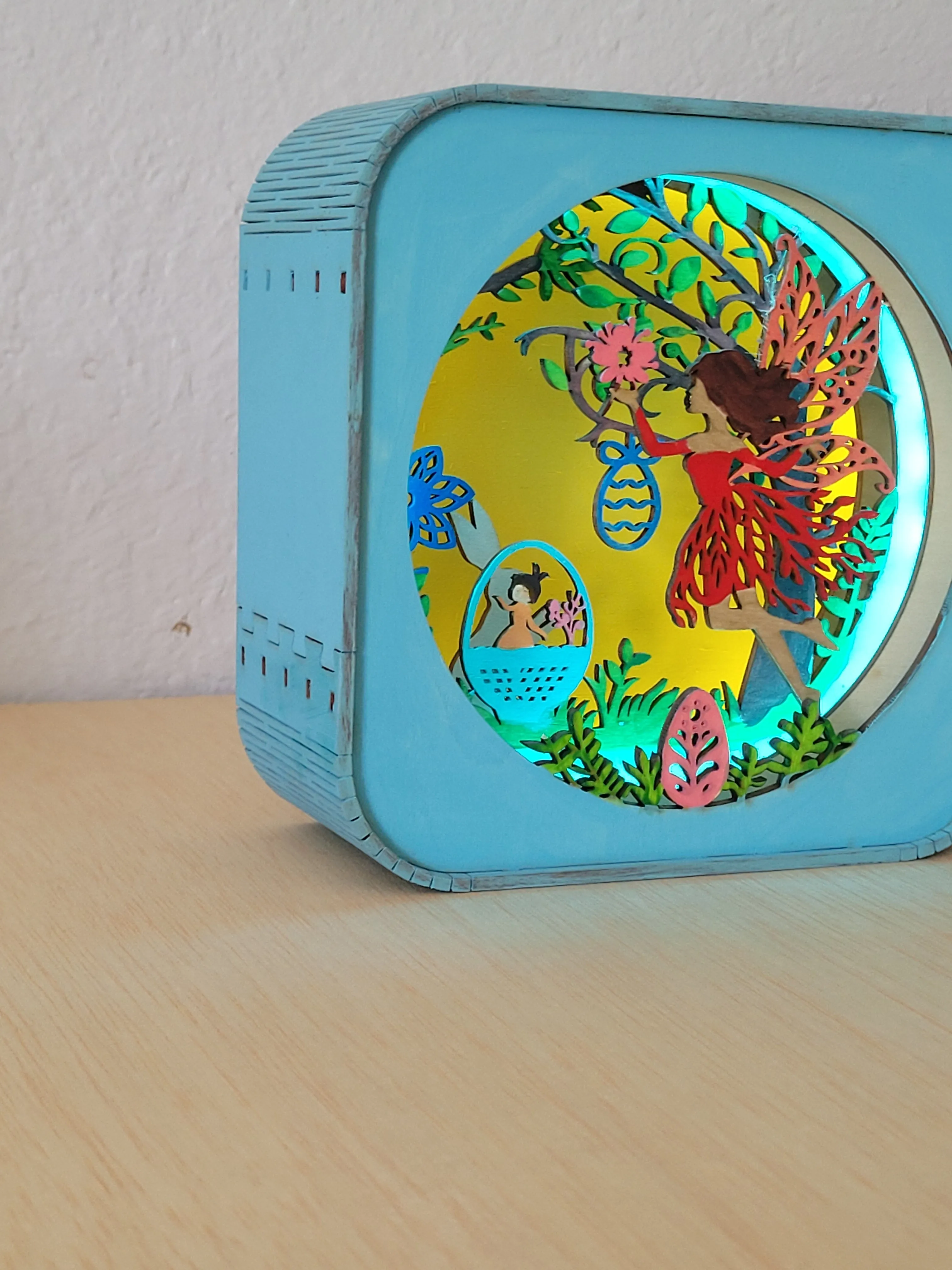 Layered wooden fairy shadow box made as a keepsake for a shelf or nightstand