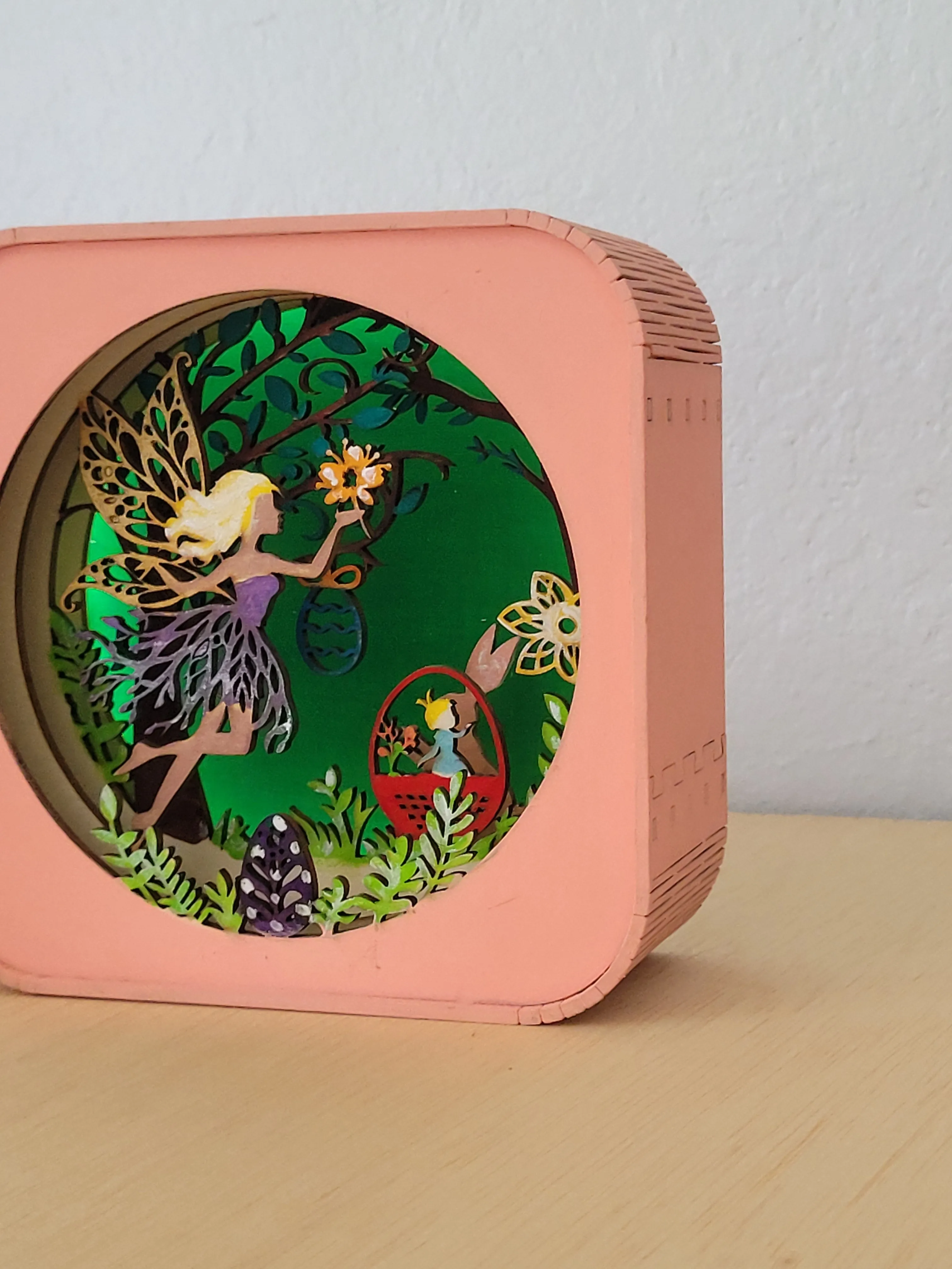 Layered handmade wood fairy shadow box with a warm stained frame