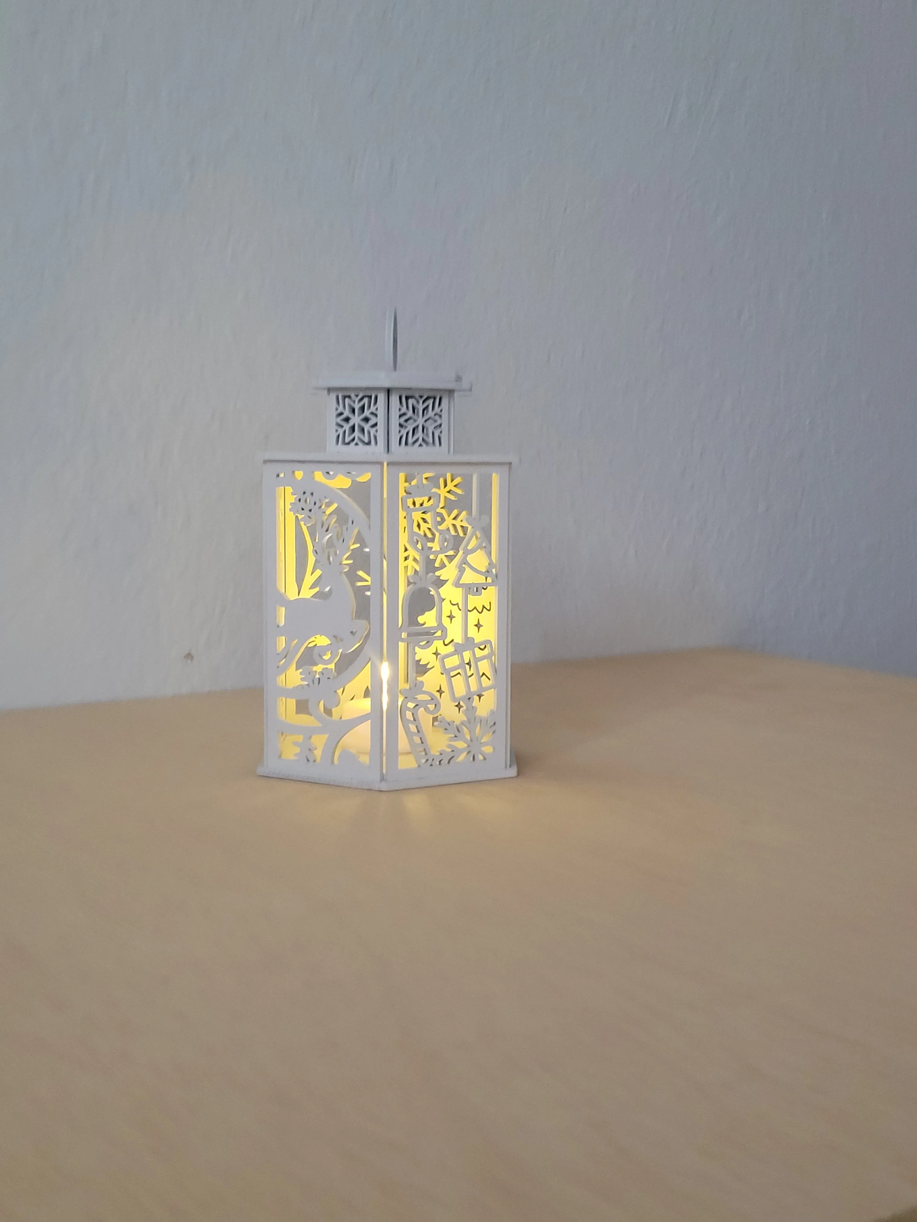 Laser-cut wood lamp that adds a warm glow to a living space