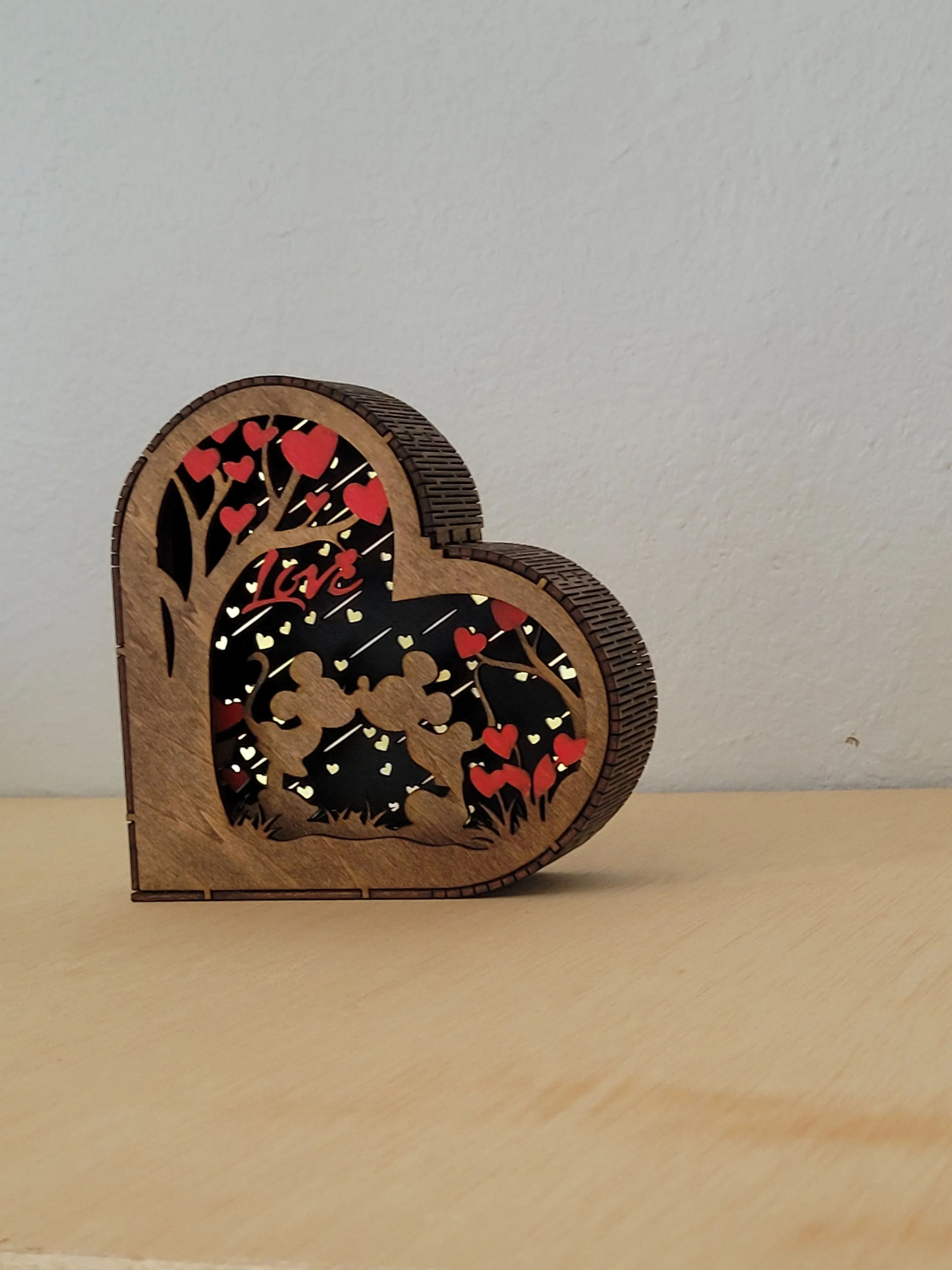 Layered handmade wood couple shadow box with a heart-shaped design