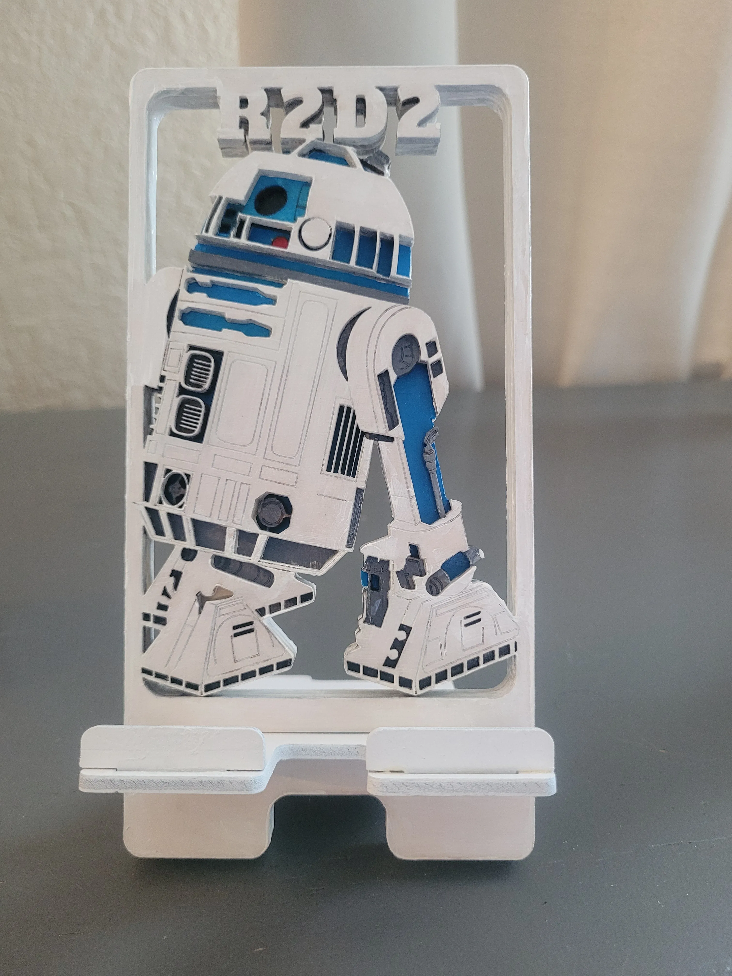 Handmade wood phone holder for a personal desk space