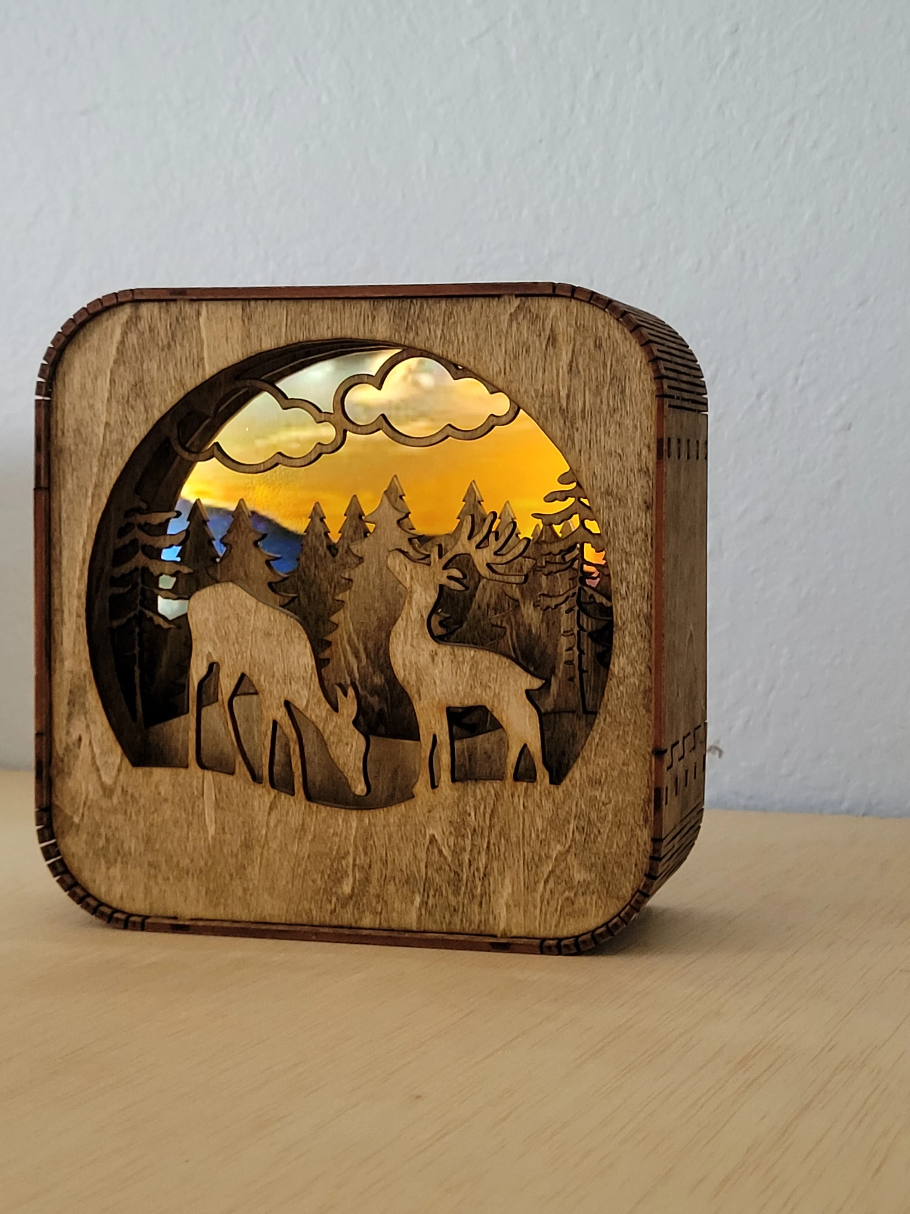 Layered handmade wood shadow box with detailed cut-out design