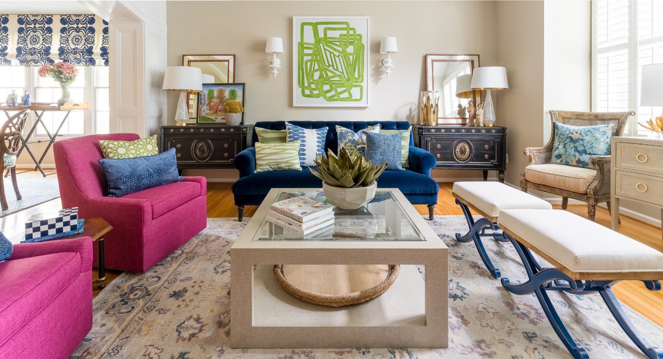 Colorful living room with blue sofa and coffee table by Kerry Leikus Designs