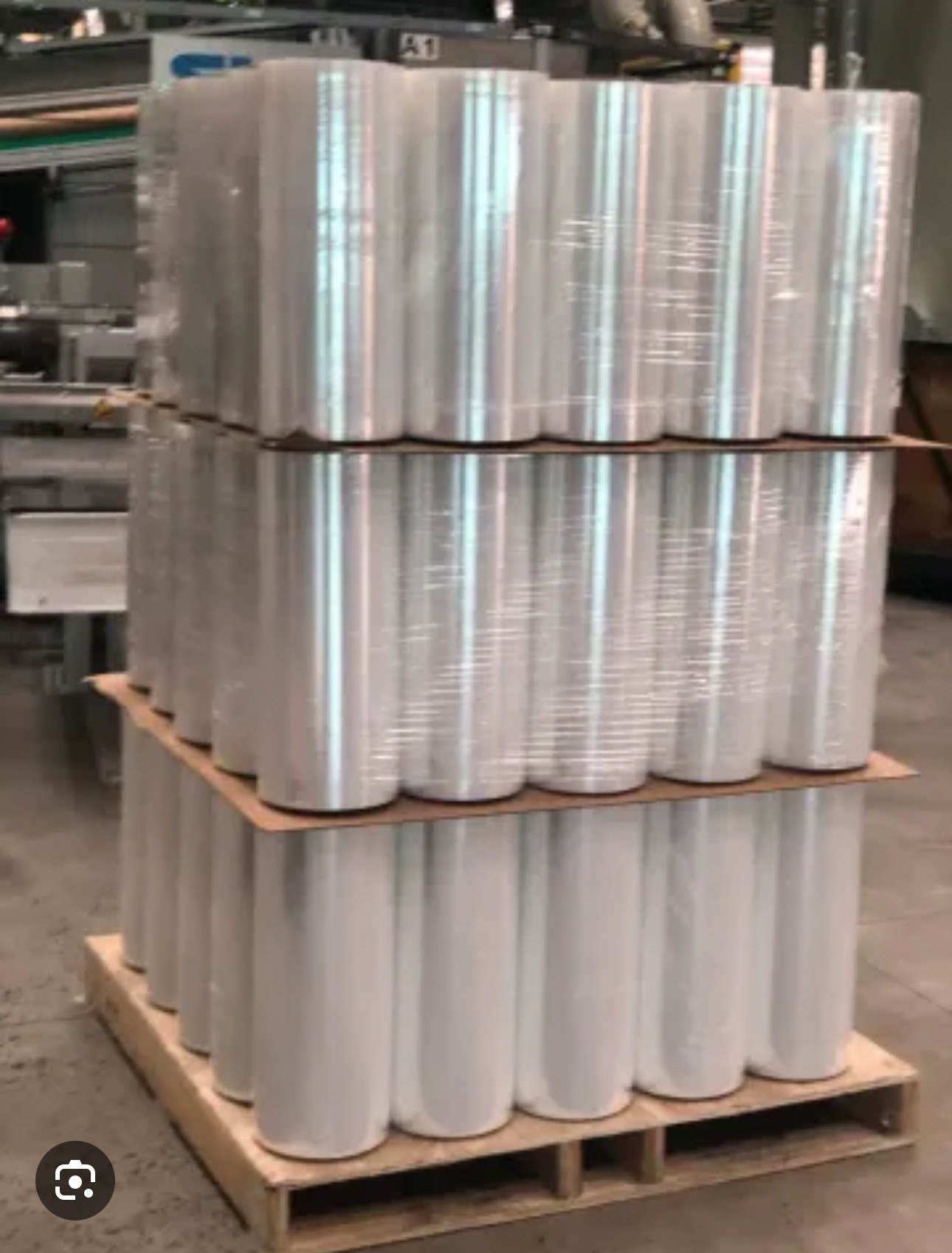 Pallet of clear stretch film rolls in a warehouse