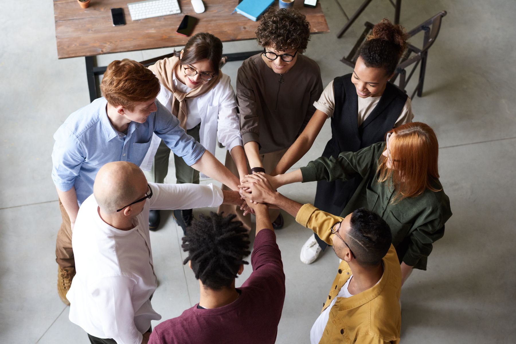 Team gathering around a table to discuss shared priorities