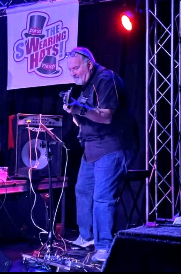 Greg Criss playing bass onstage