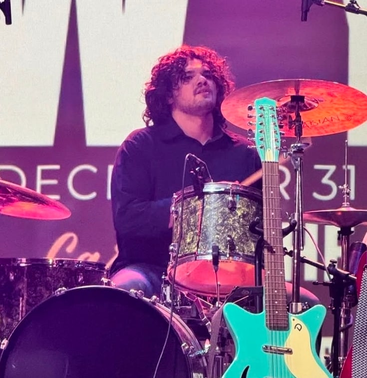 CEC drummer playing during a summer performance