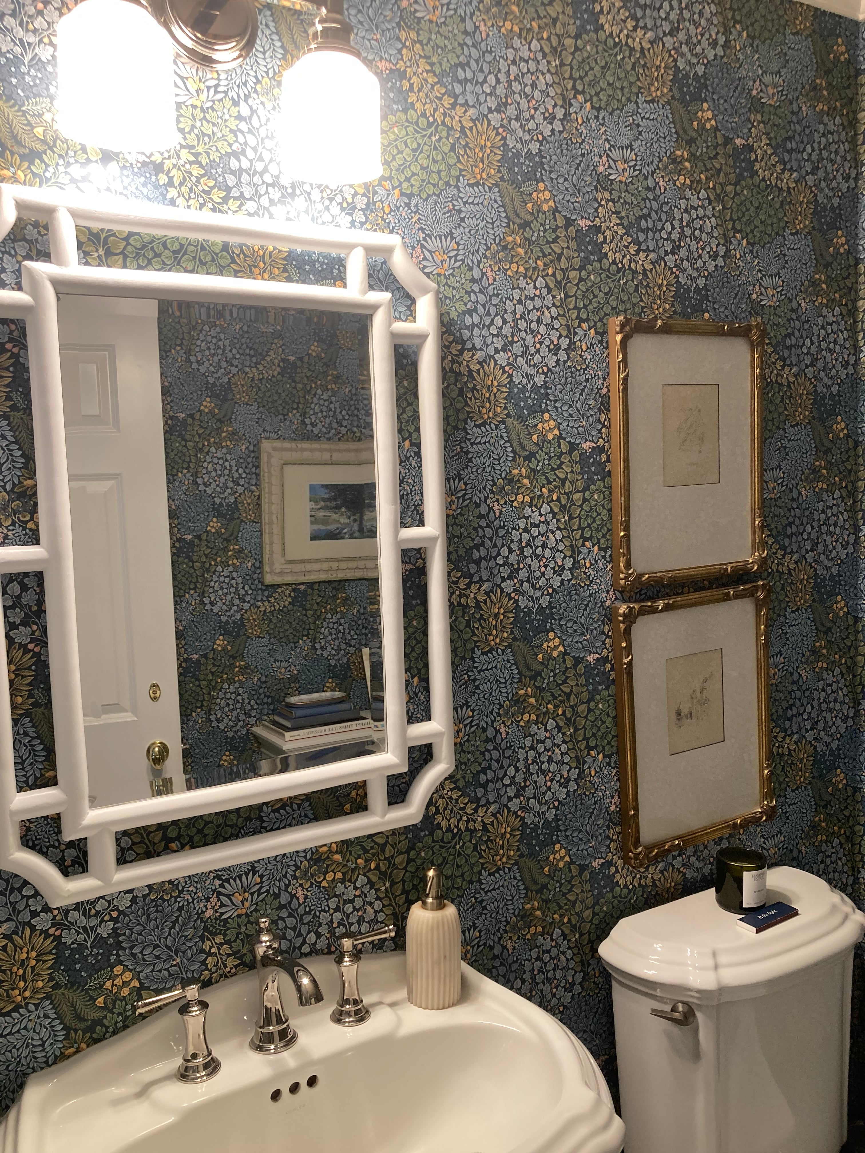 Blue floral wallpaper in a finished bathroom