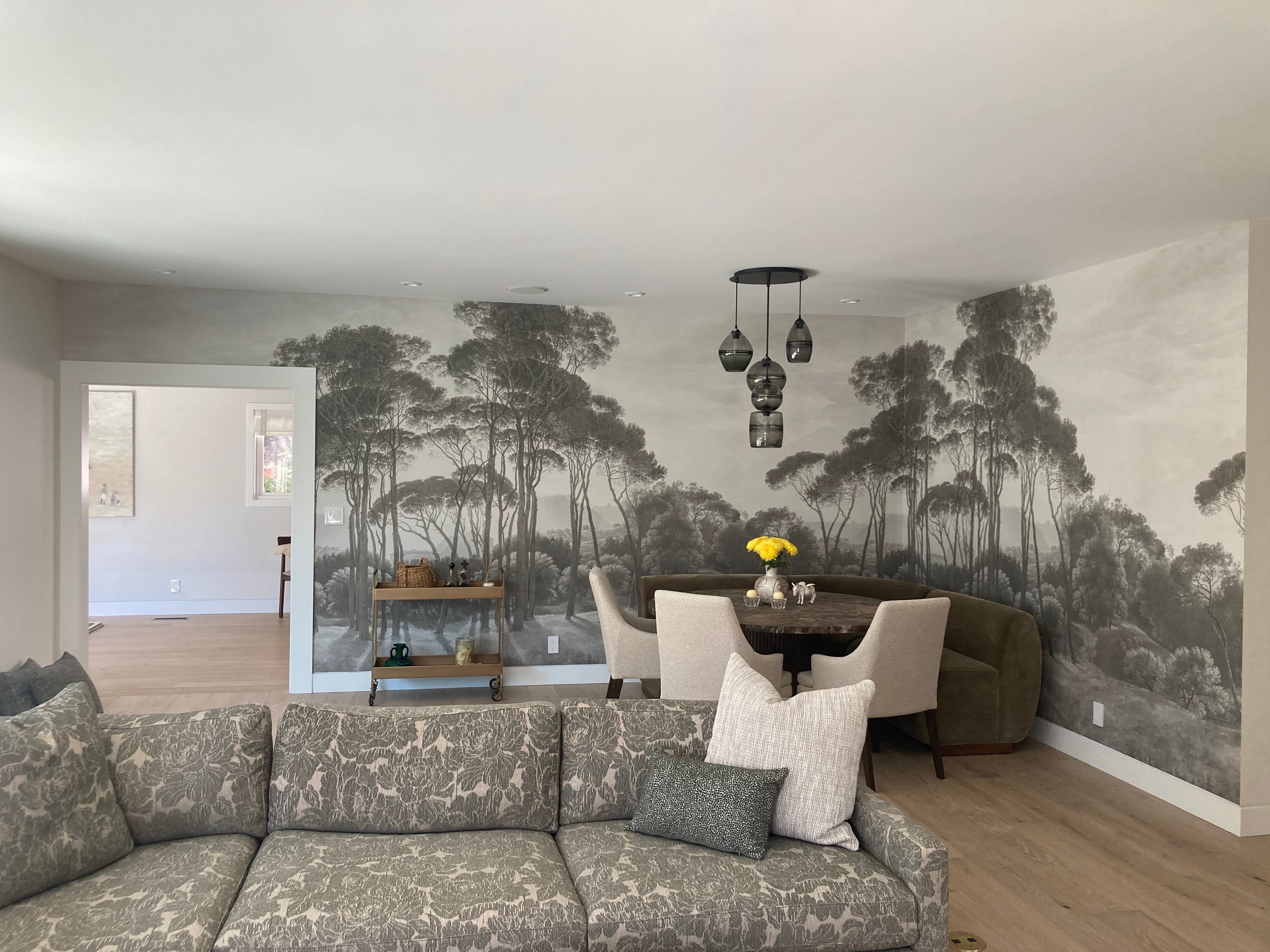 Landscape wallpaper mural in a finished living room