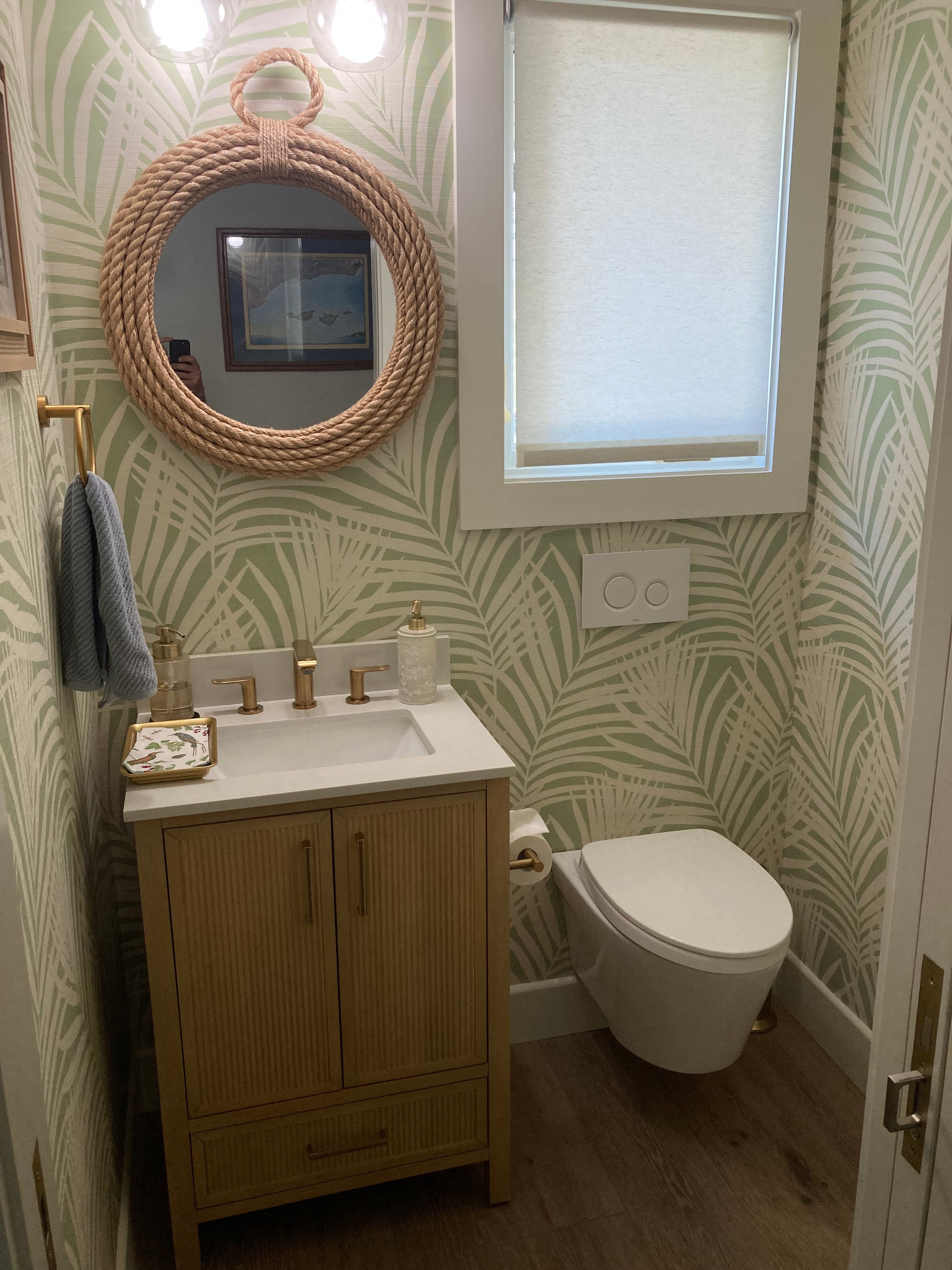 Palm wallpaper in a finished bathroom
