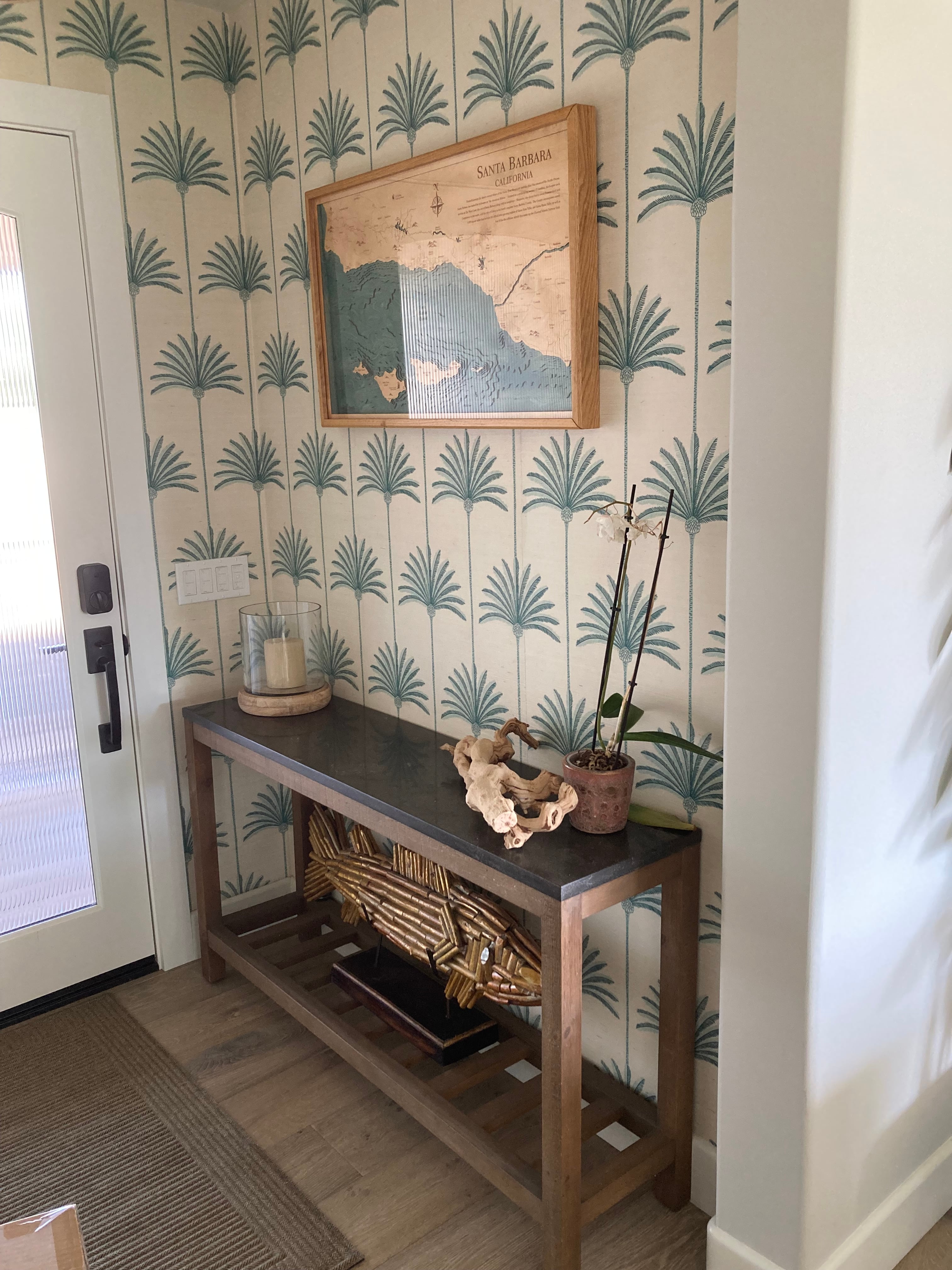 Palm wallpaper in a finished entryway