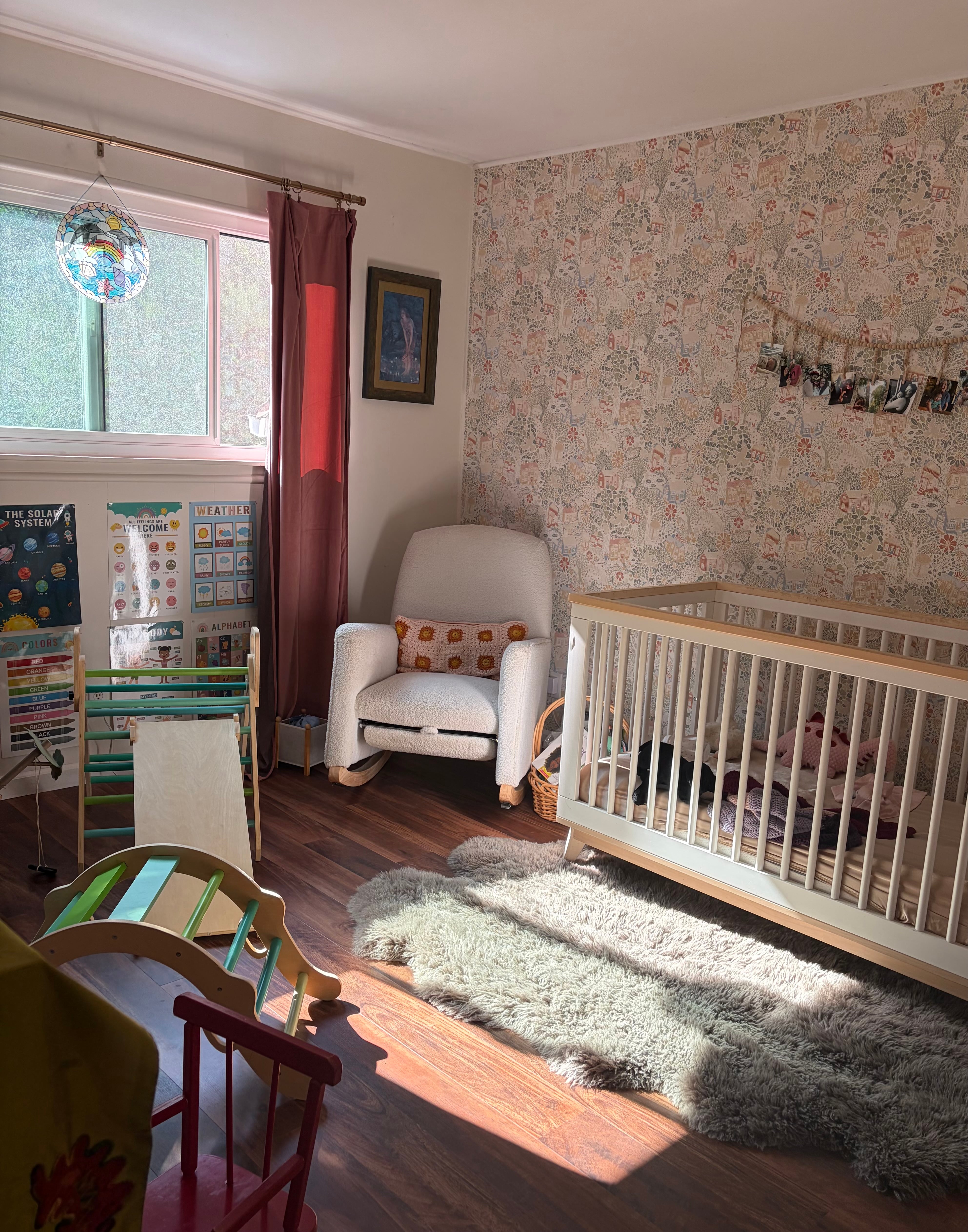 Finished nursery with patterned wallpaper