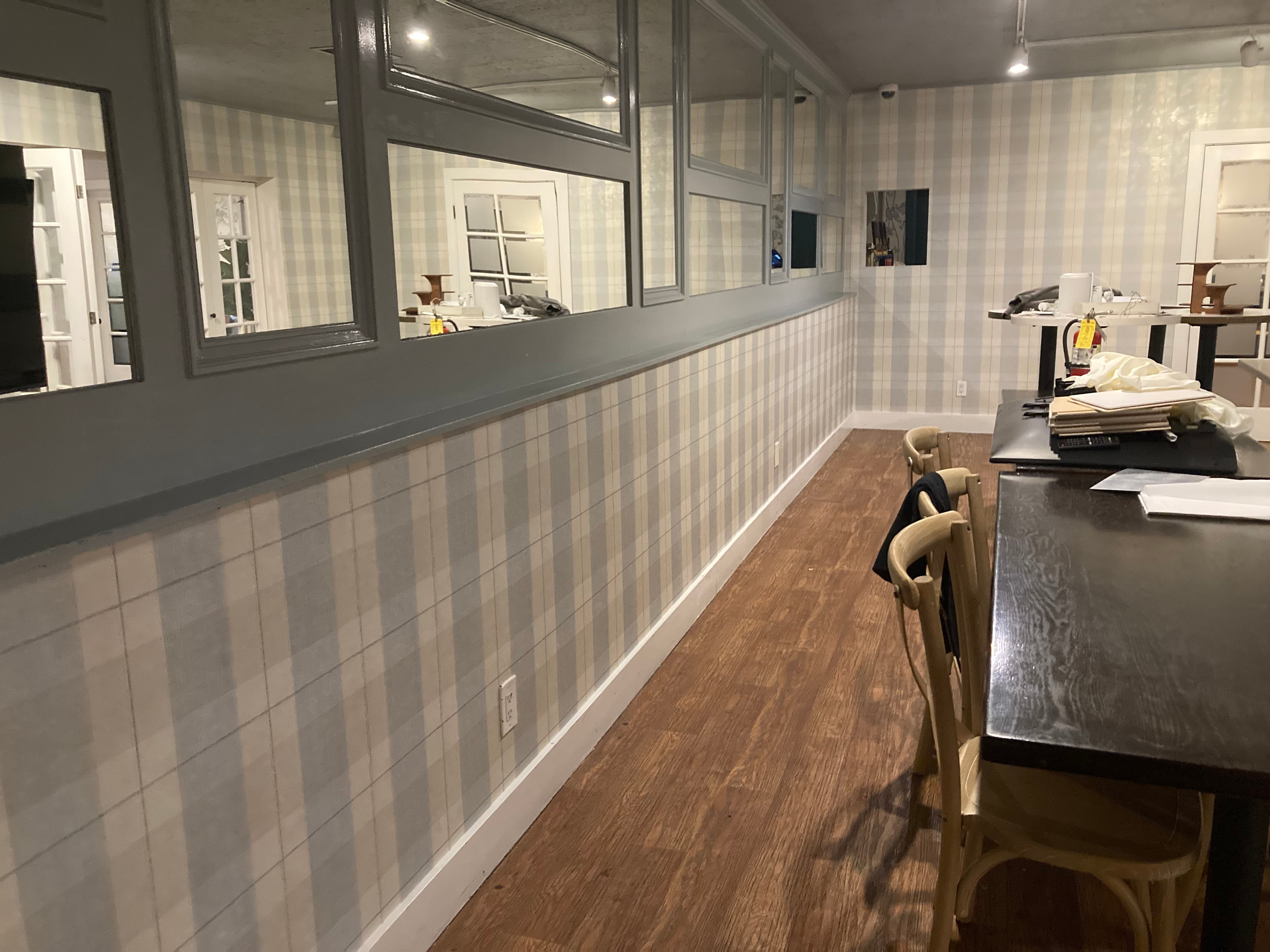 Plaid wallpaper installation in a finished interior