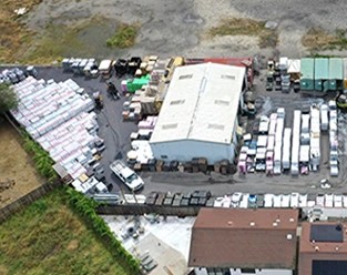 Aerial view of the Affordable Roof Supply Ripon yard with pallets of roofing materials