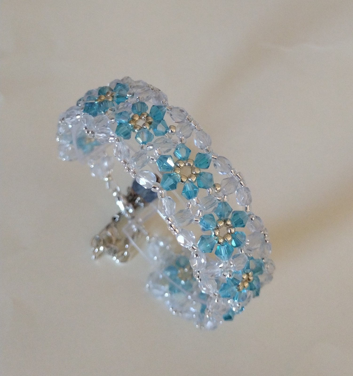 Arctic Kiss Bracelet wrapped to show its blue crystal flower pattern